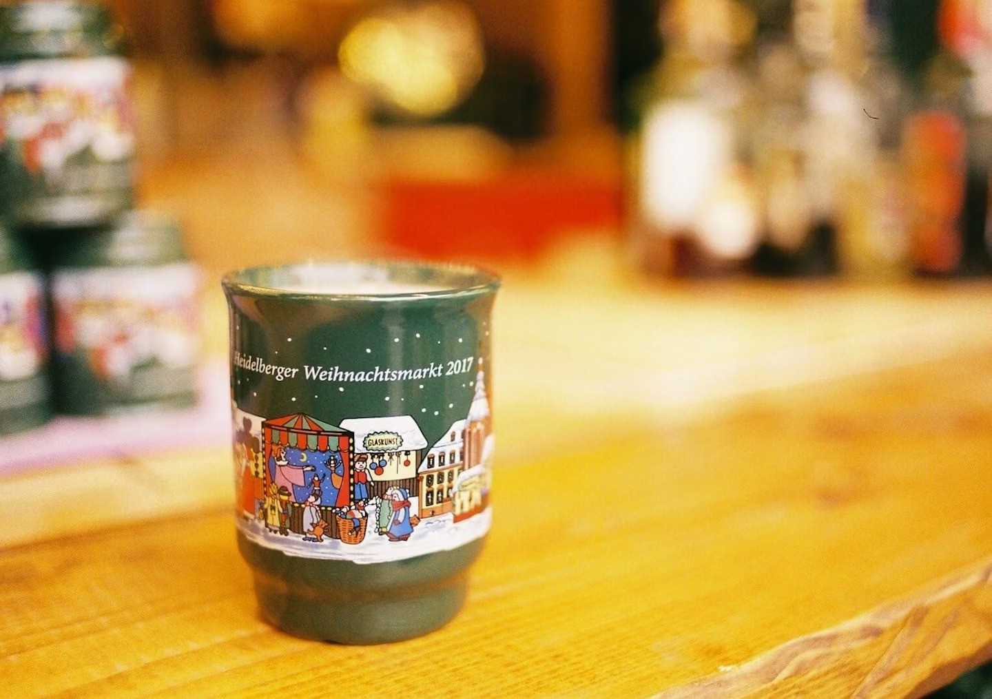 shallow focus photo of brown liquid in clear glass cup
