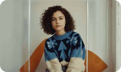 Team member in a patterned sweater