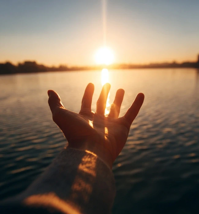 Human hand and the sunset