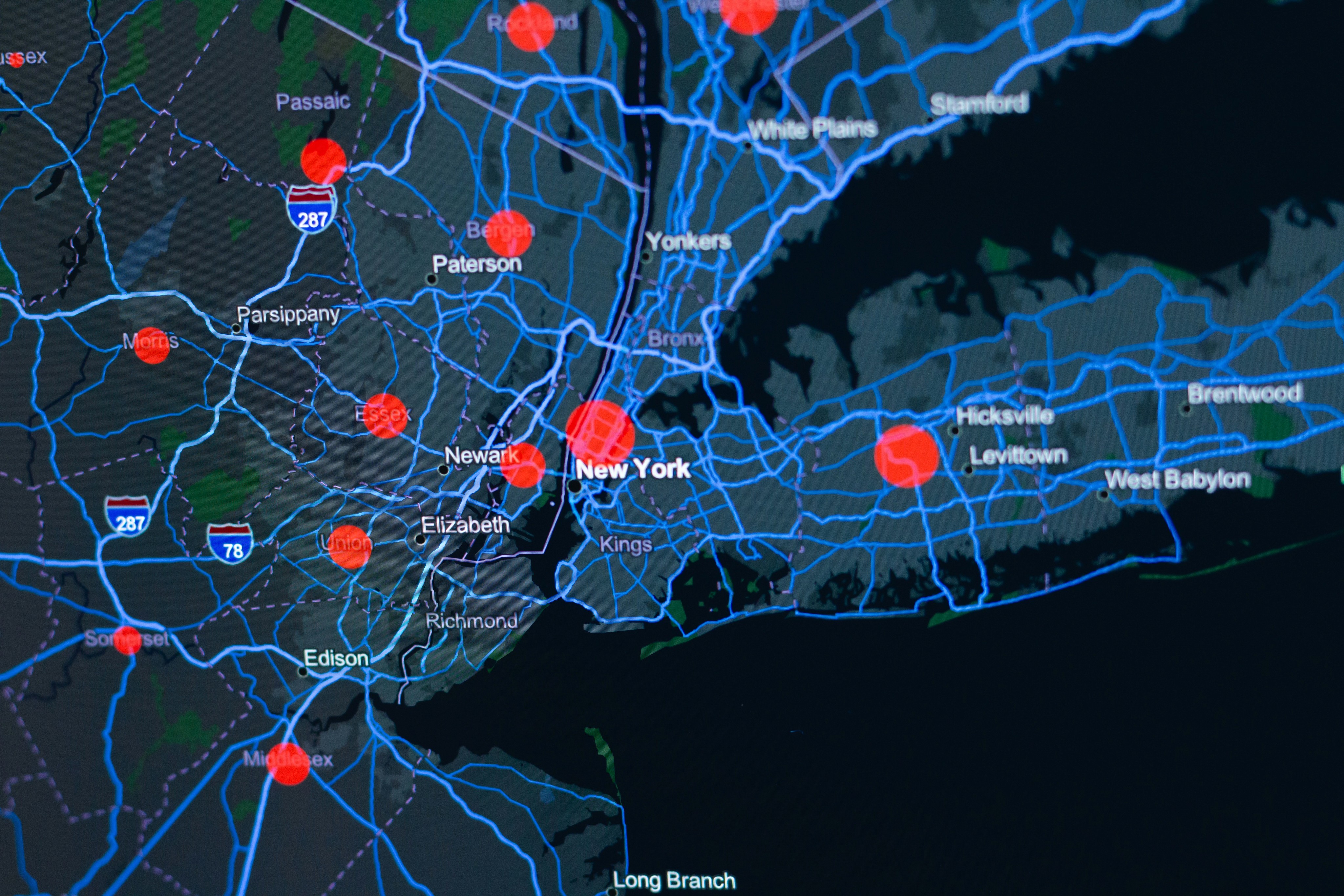 An abstract photo of a digital dashboard representing various fraud hotspots on the map