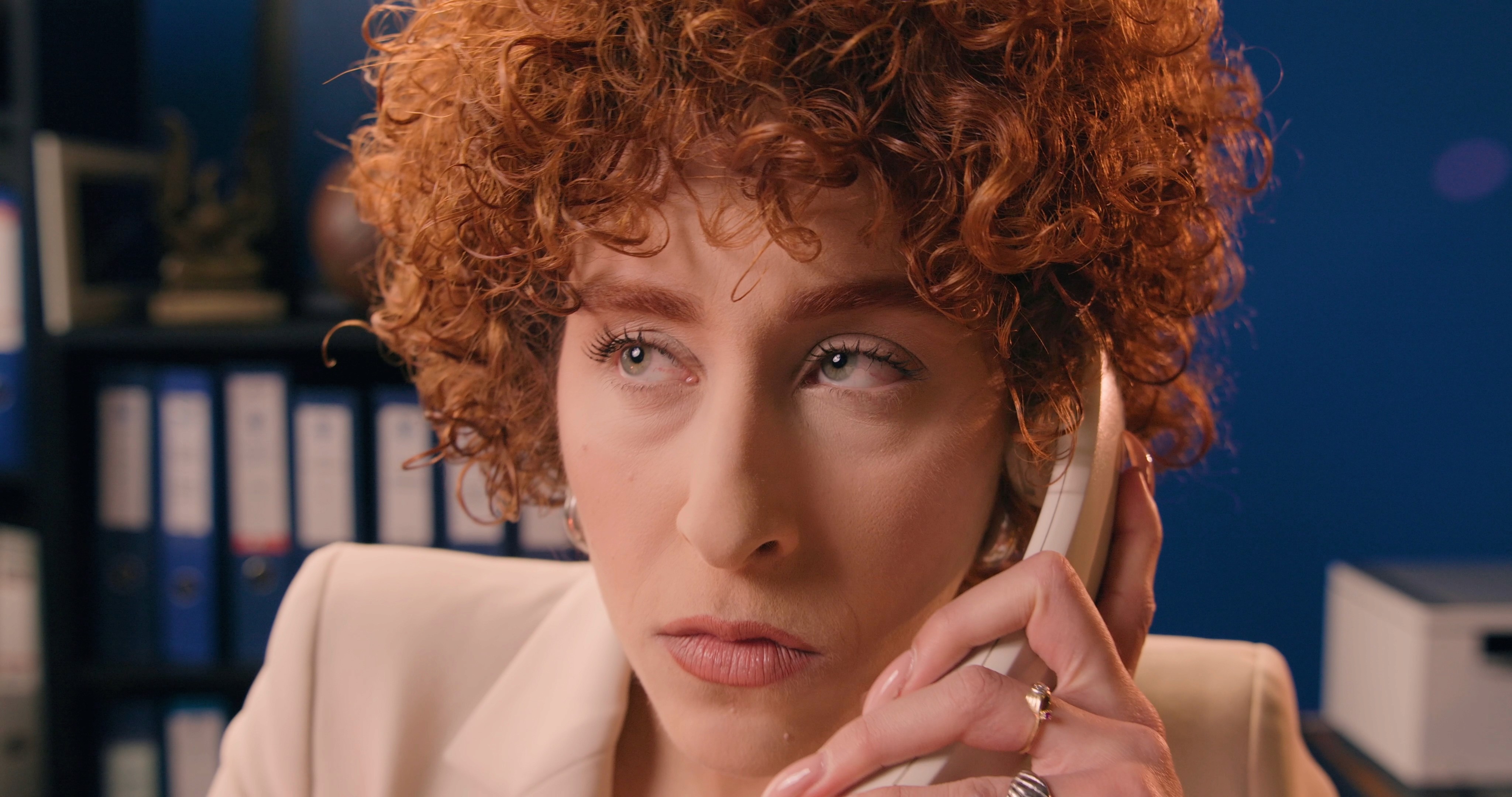 Anorthosis secretary feeling stress while talking on the phone