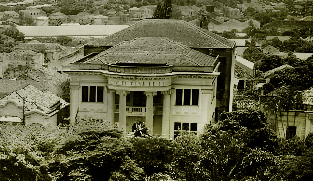 group of women in red and white dress standing on brown wooden bar during daytime