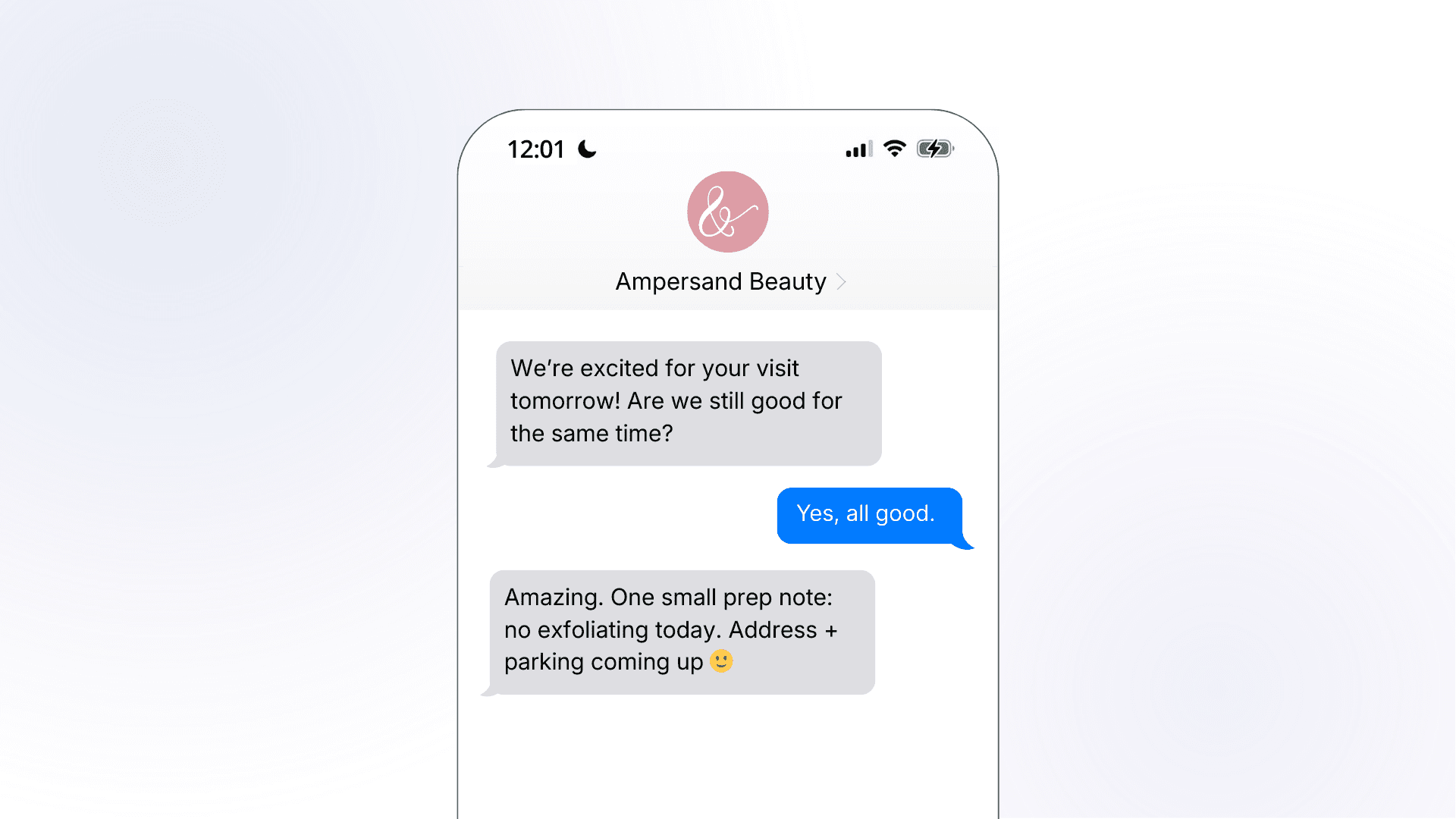 A smartphone mockup showing an Ampersand Beauty pre-appointment SMS reminder, where the salon confirms the next day's visit, gets a soft confirmation from the customer, and follows up with a prep note and promise of address and parking details.
