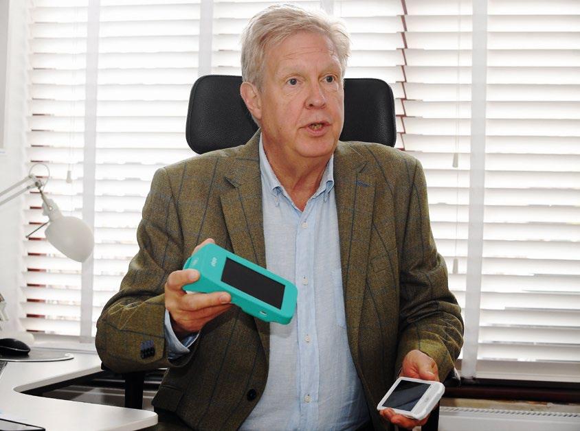 Nicholas Gould holding DOJO Payment Terminals