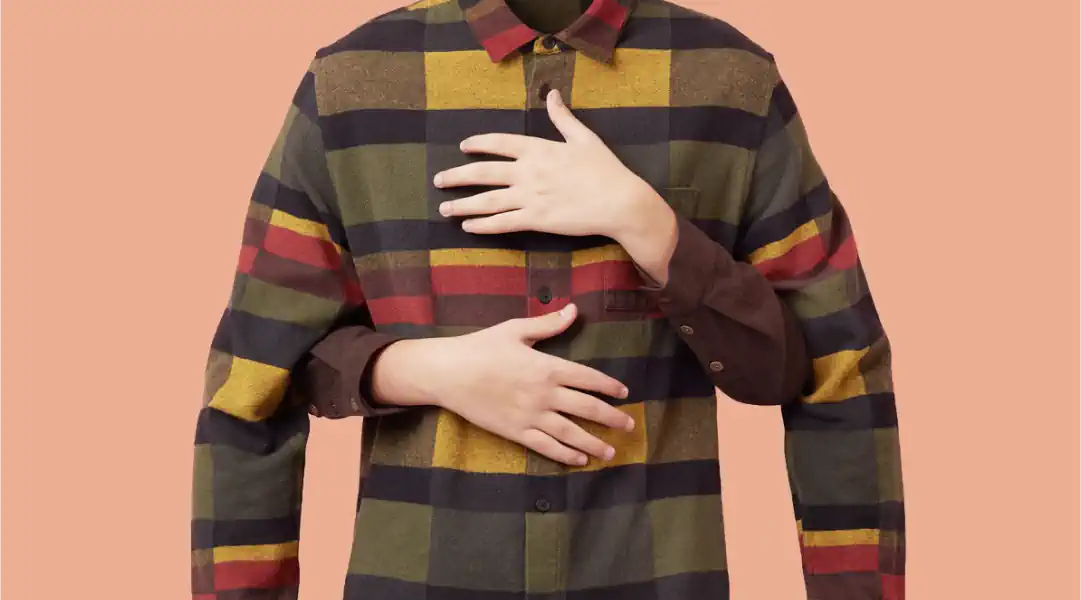 Union of Finland a plaid shirt, hands clutching chest