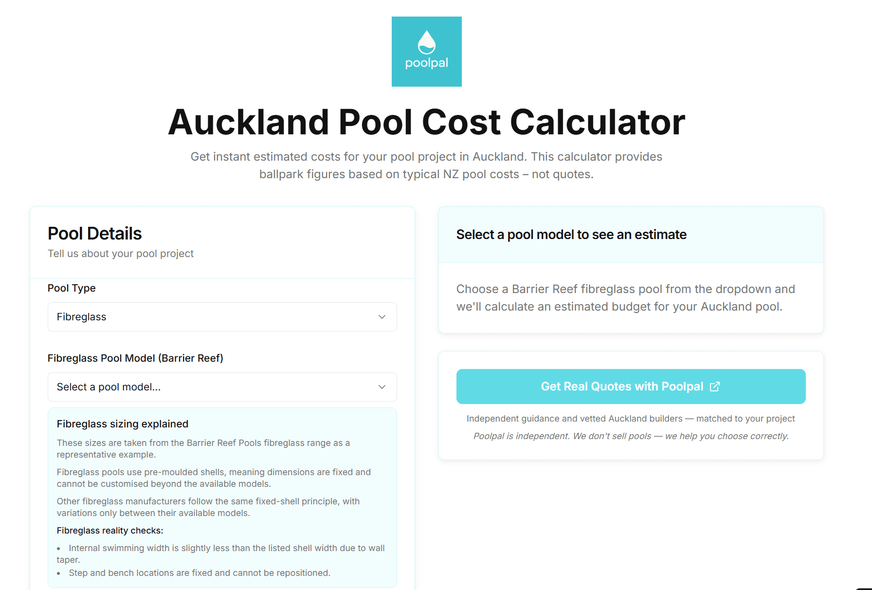 Hand holding house keys over miniature houses
