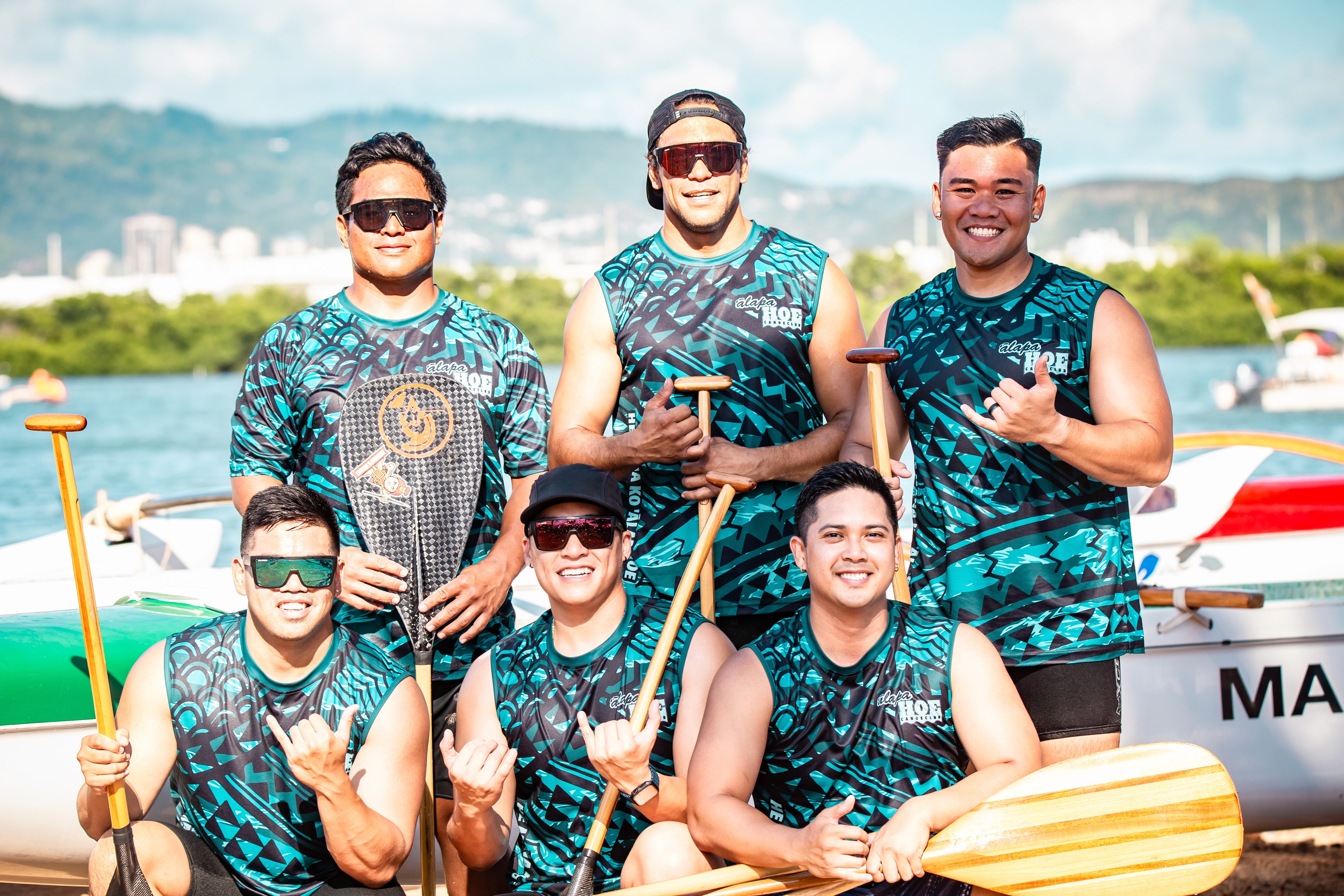 A man standing with Sufboard
