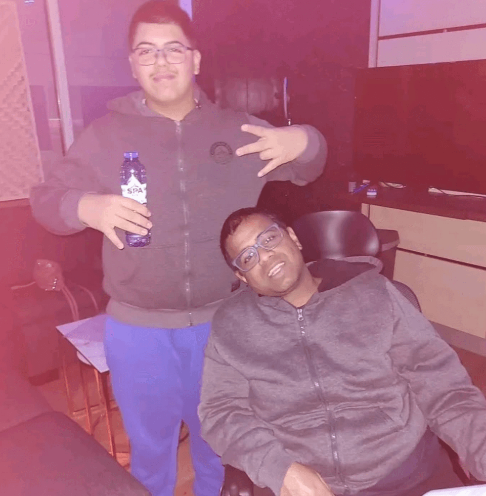 Silhouette of a woman against a dark brown silk background