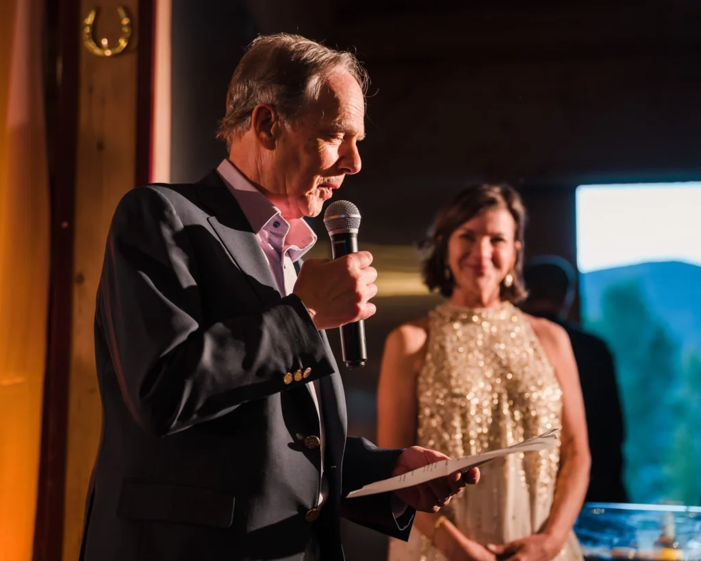 Man delivering a wedding speech as a woman stands beside him