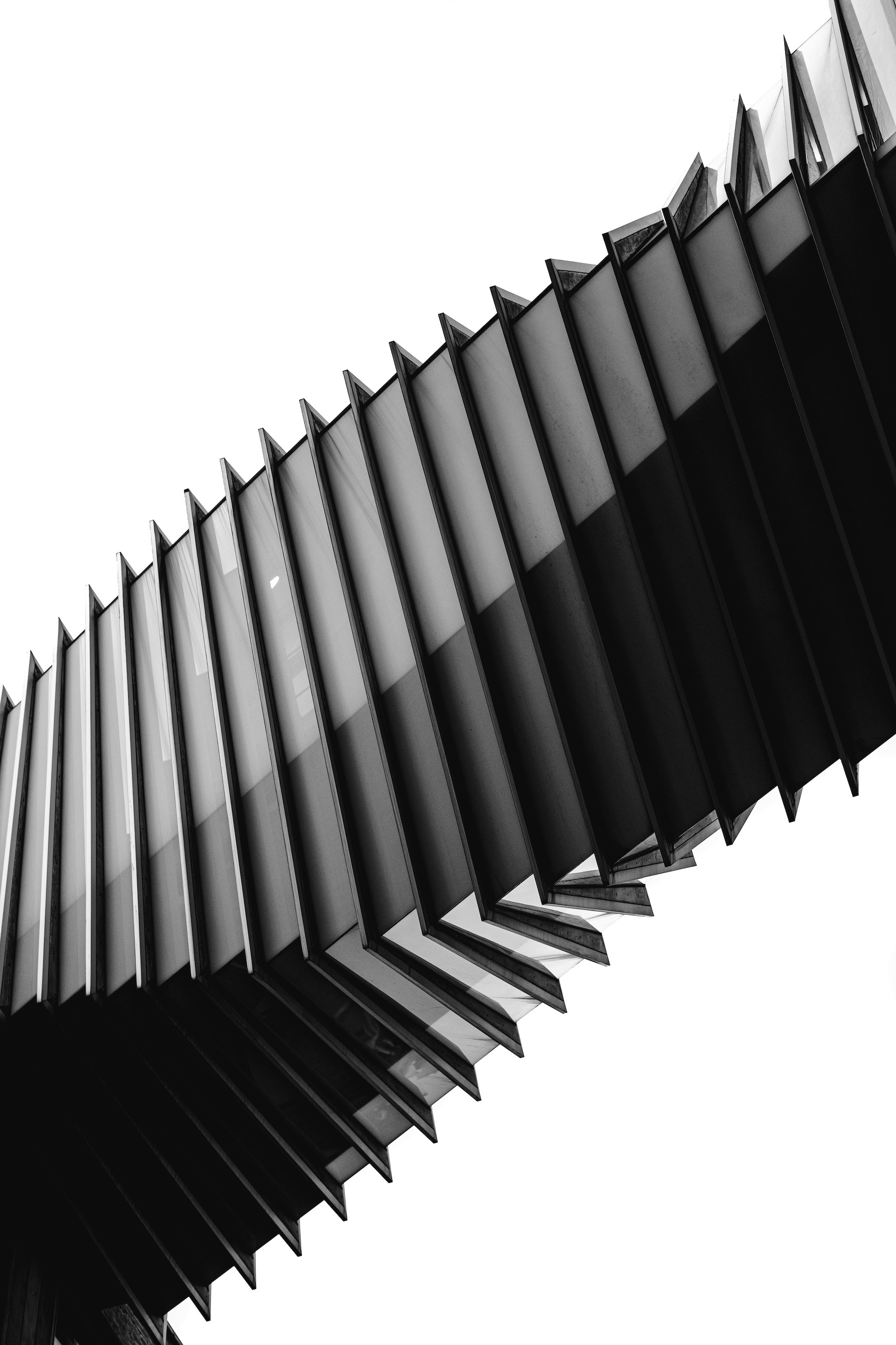 Person in dark cloak stands in glowing orange sandstone canyon