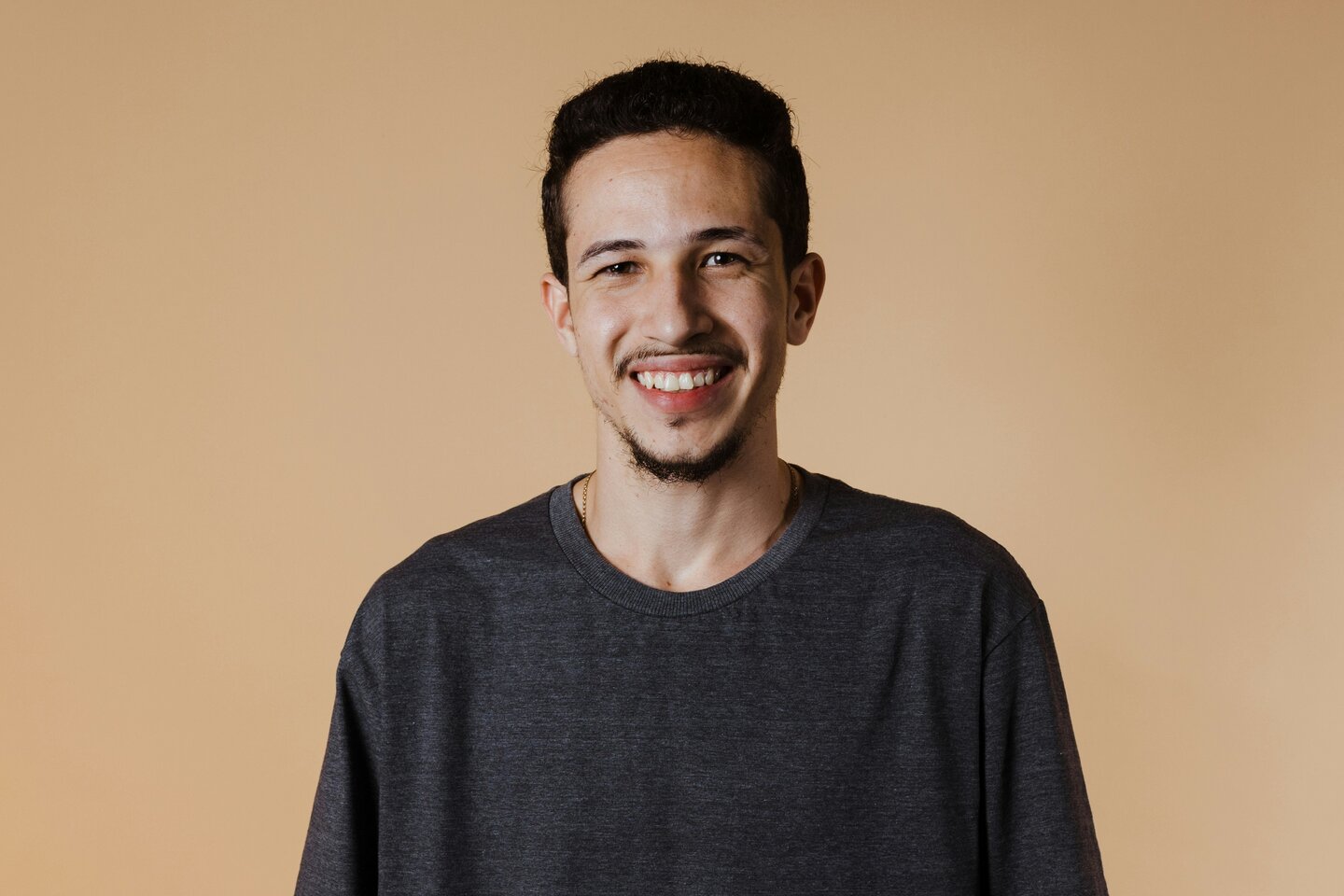 a man in a white shirt is looking down