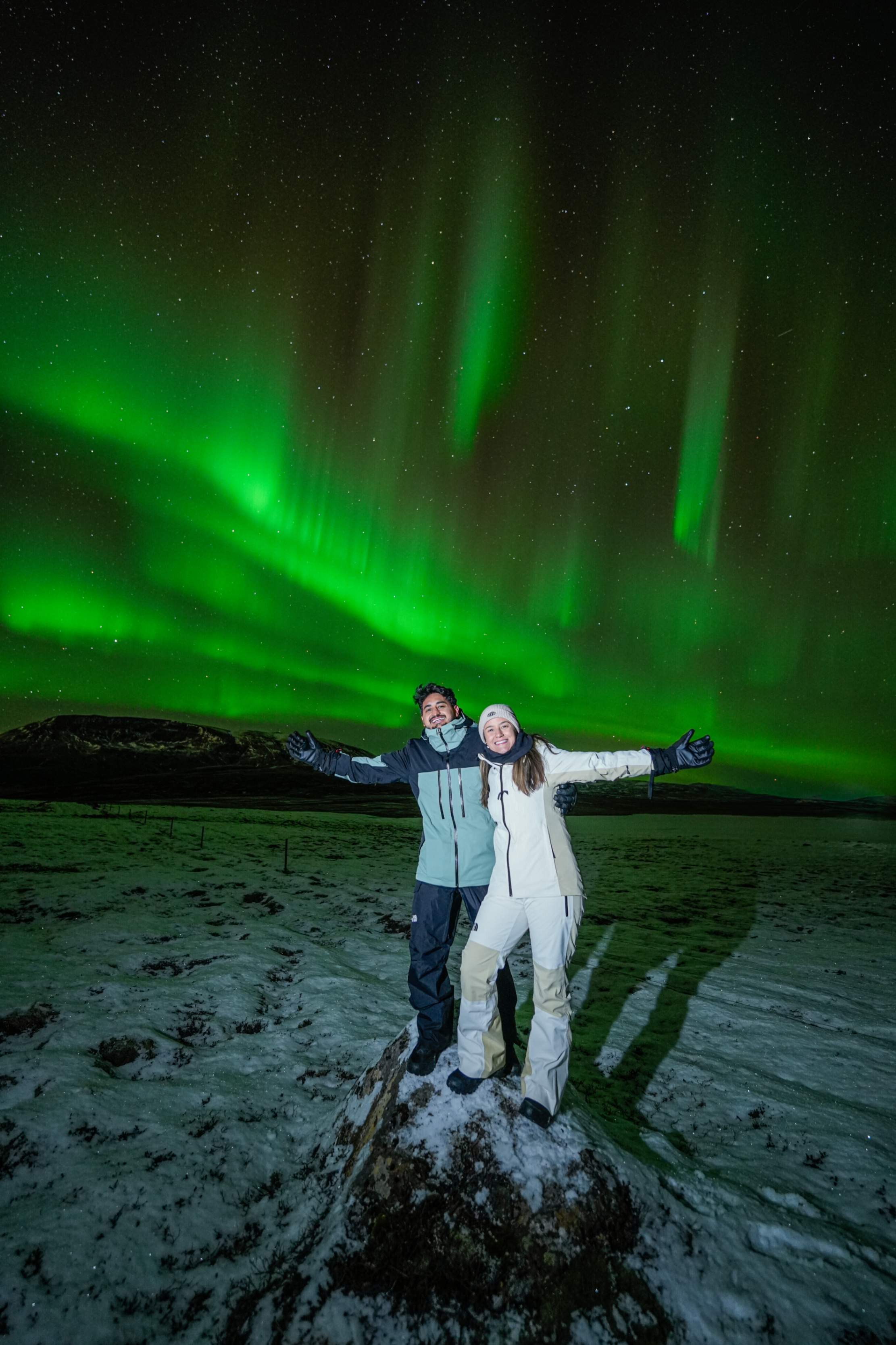 Northern Lights tour photography from Aurora Experts in Iceland, featuring guests beneath the aurora, winter landscapes, and vivid skies over remote Icelandic locations.