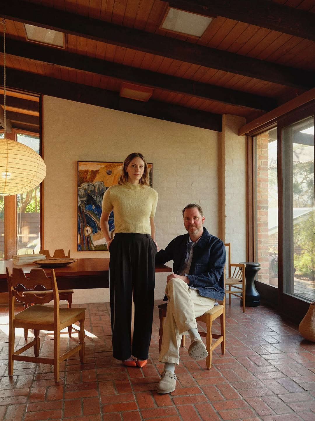 a host couple in the dining room of their house