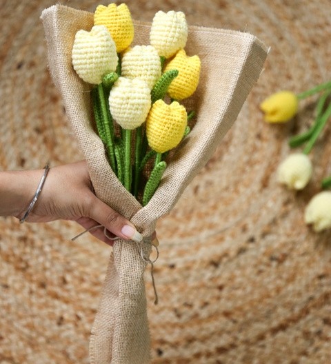 Handmade crochet yellow tulip flower bouquet wrapped in jute fabric