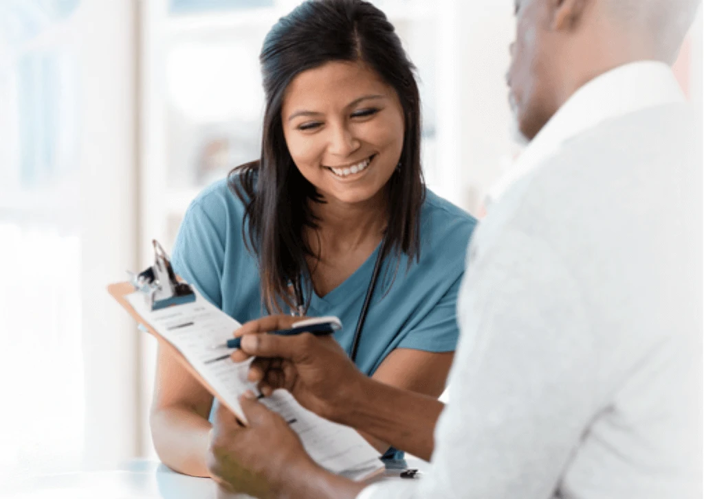 nurse and doctor examine paperwork