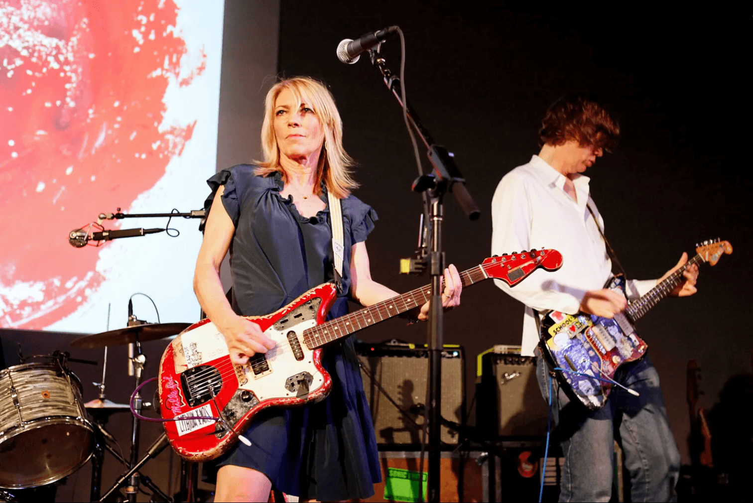 A color photo of Sonic Youth performing
