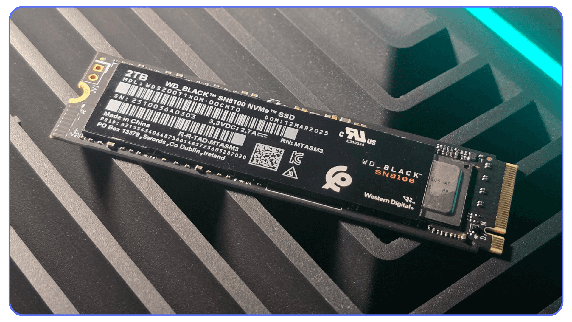 Western Digital WD Black 2TB NVMe SSD placed on computer case surface