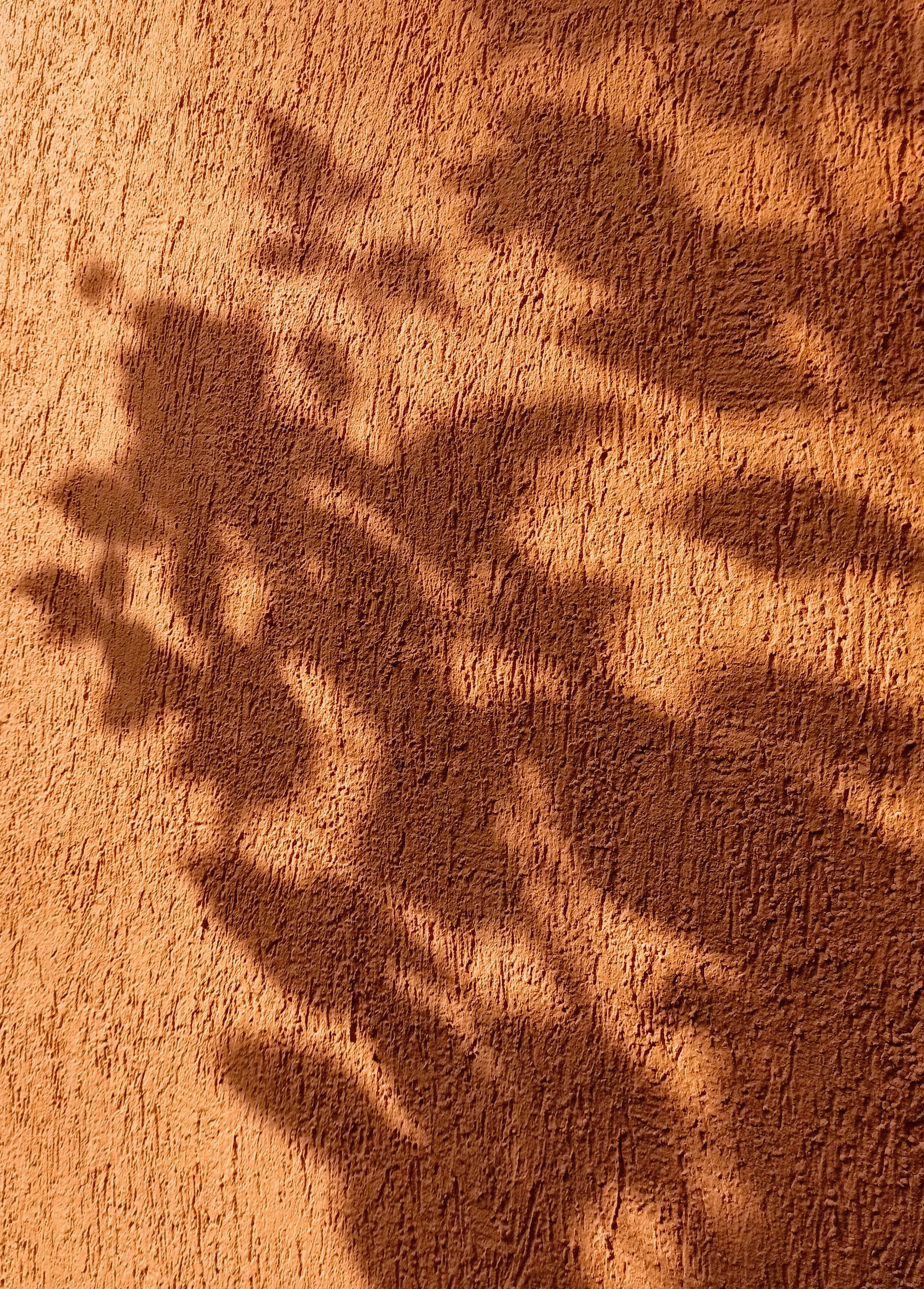 brown sand with shadow of person