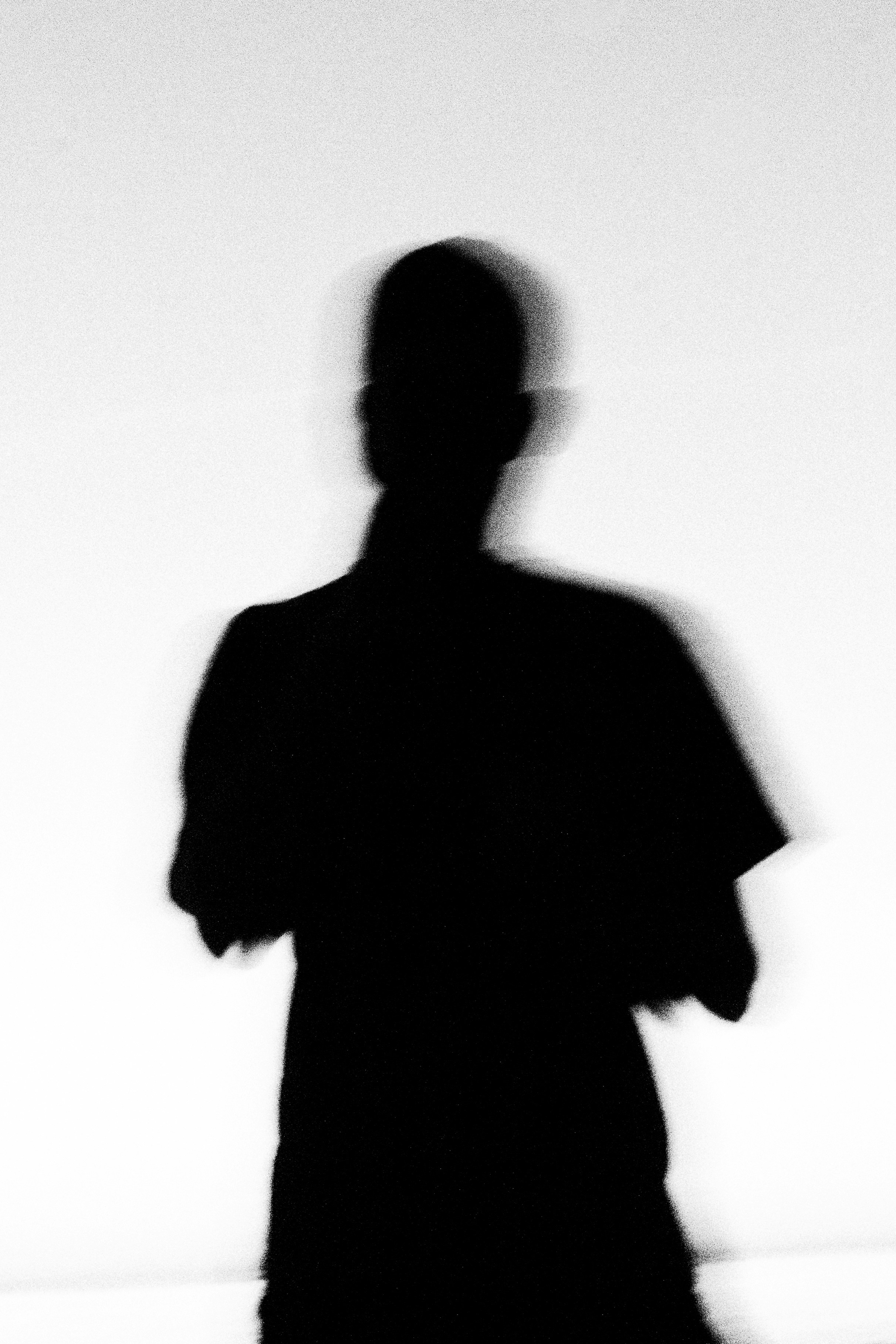 Silhouette of a person against a white background.