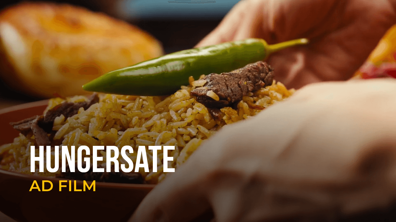 Close-up of rice being served in a scene from a Hungersate ad film.