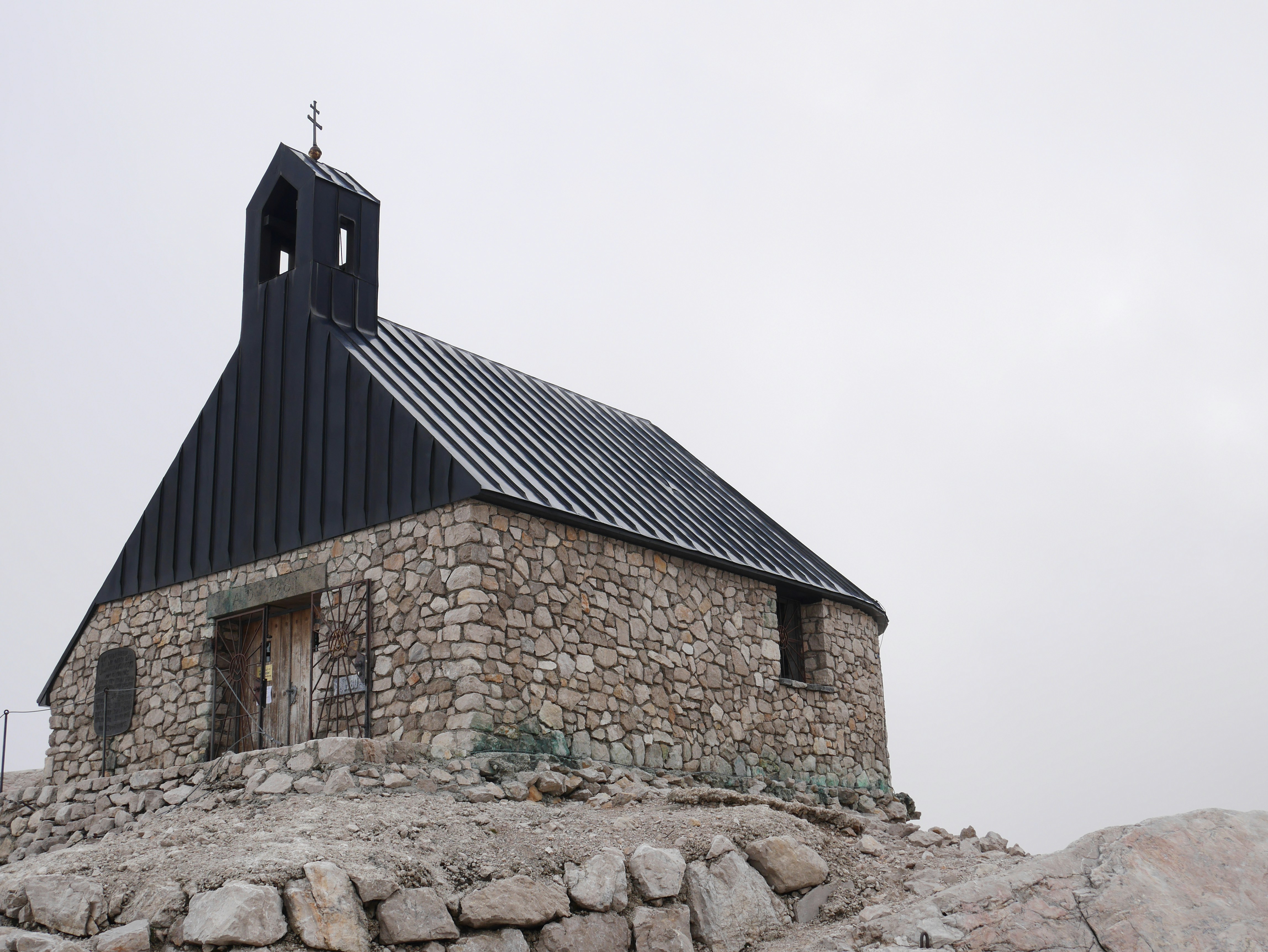 a stone building with a stone wall