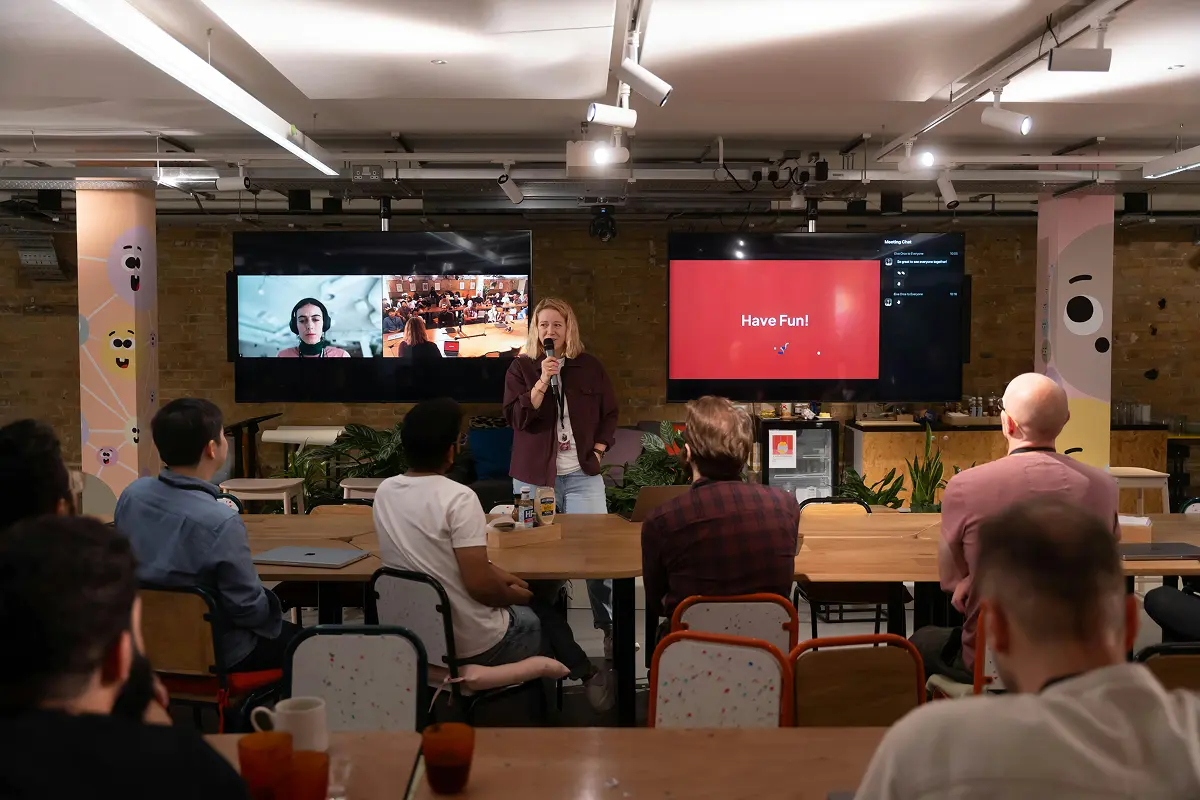 Hybrid workers holding a virtual meeting at their well-designed office.
