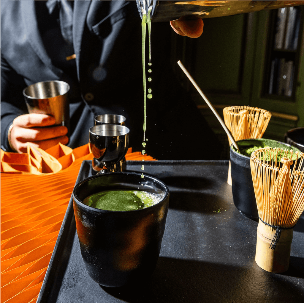 A bartender mixing a cocktail