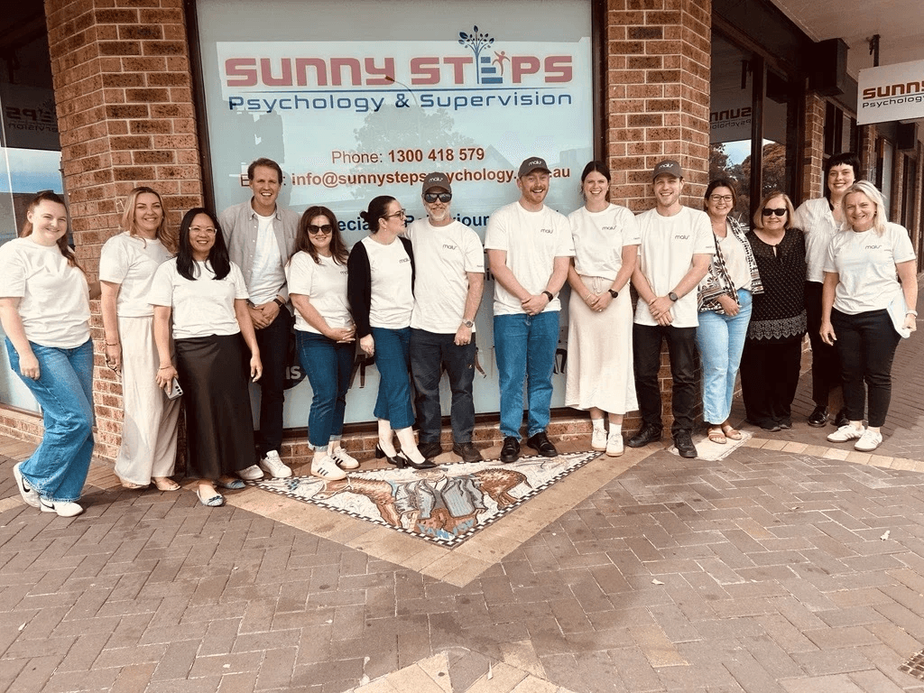 Sunny Steps team photo in front of clinic building