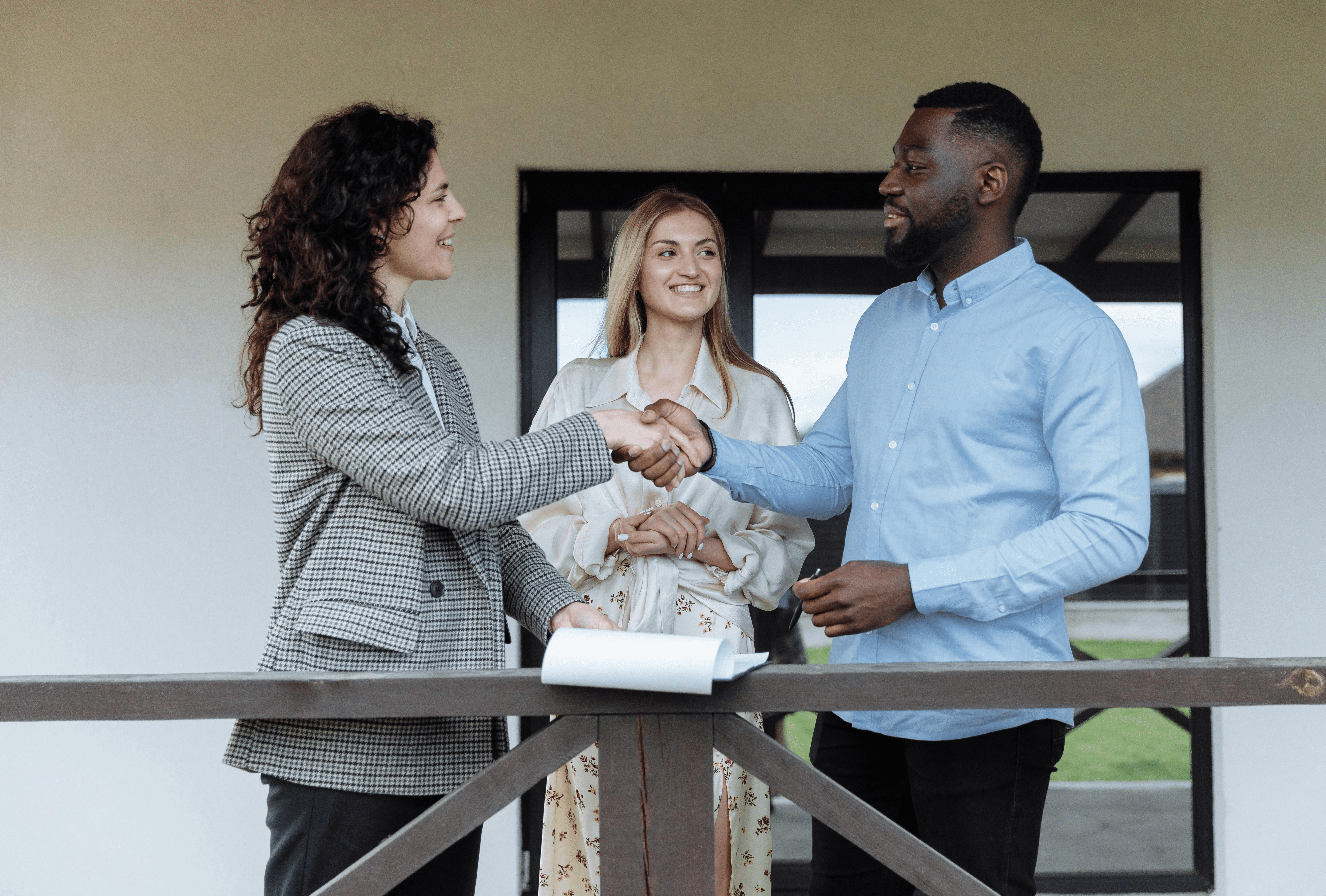 a man shaking hands with a property expert