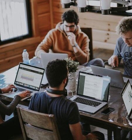 guys working on their laptop during a hackathon