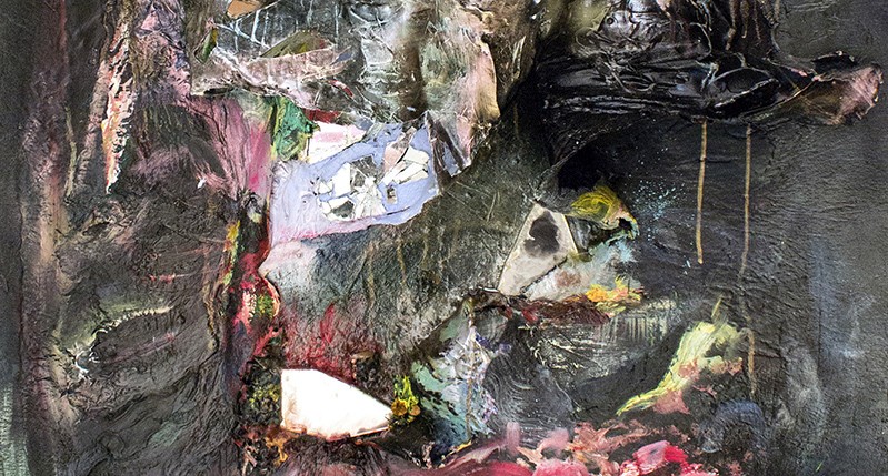 A messy abstract paining with gray and other colors.