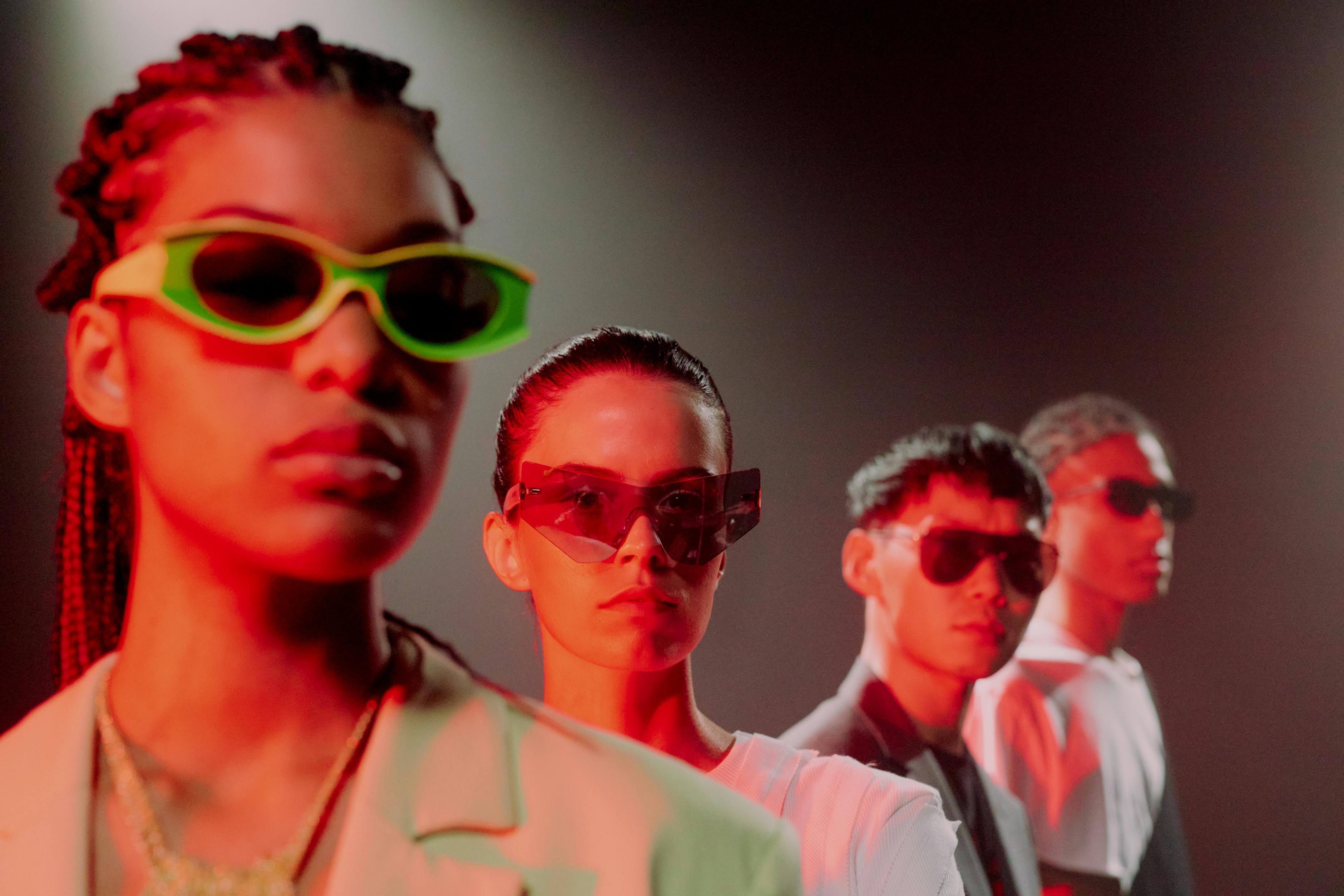 People with sunglasses casted red lighting