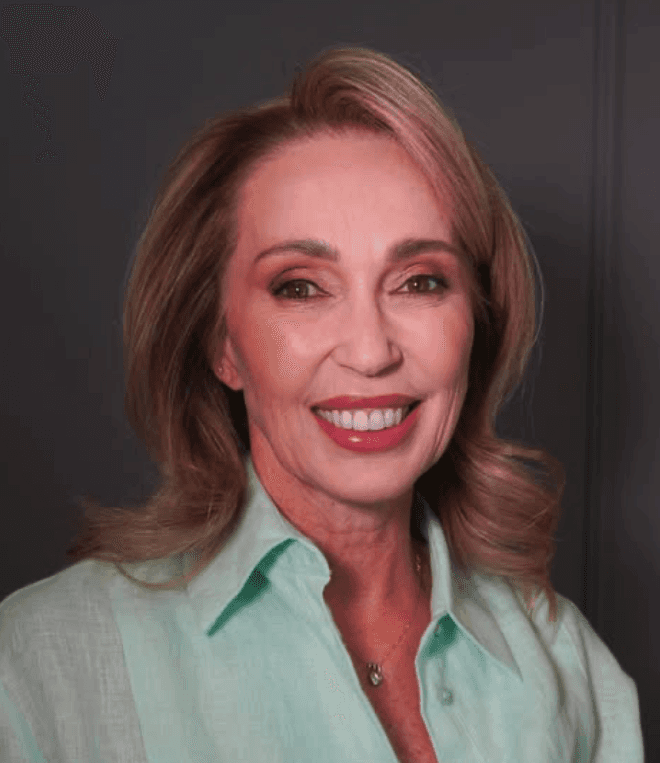 Beautiful woman smiling with her hands on her cheeks