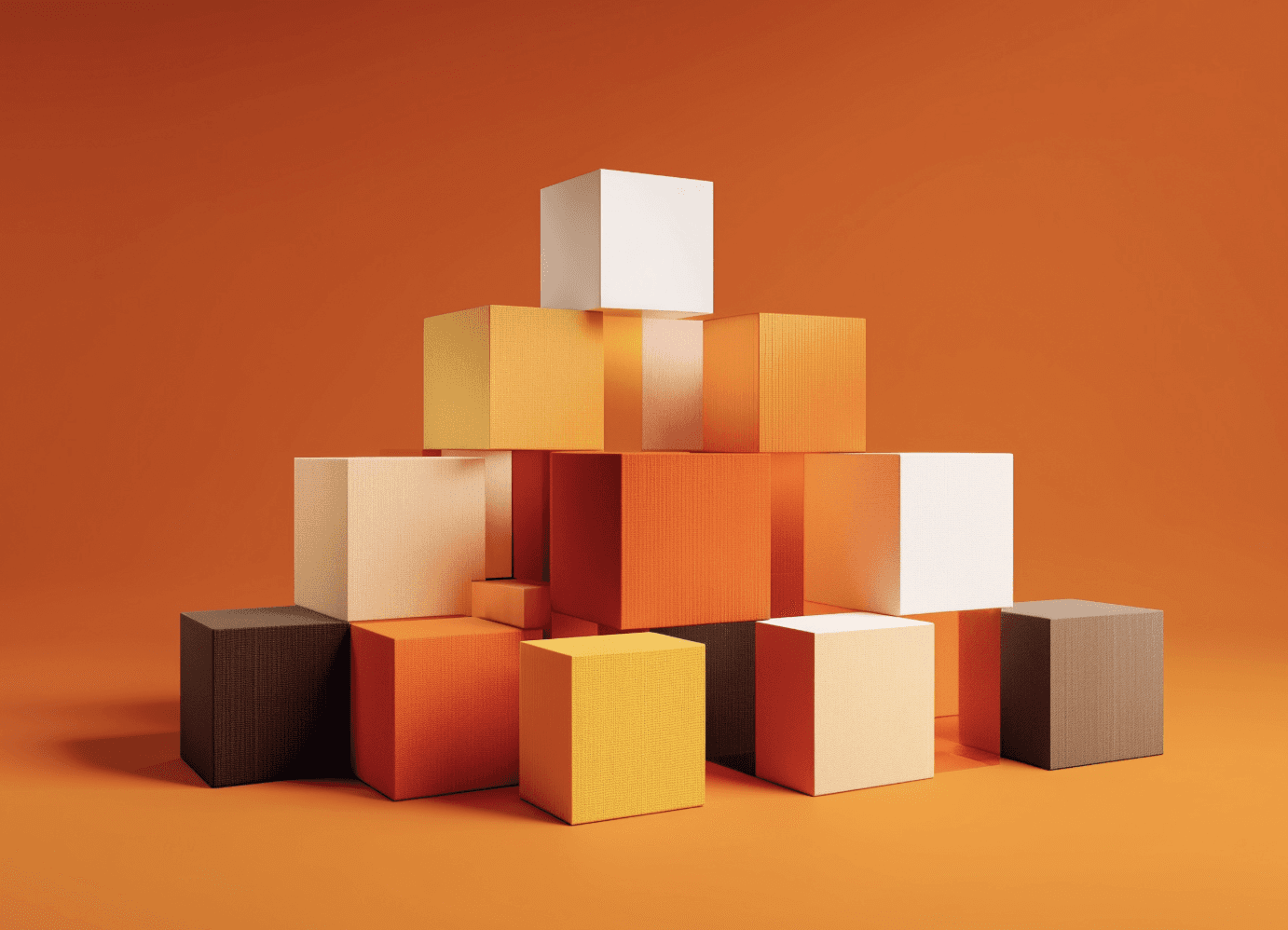 Two men discuss a project while standing at a laptop in an office.