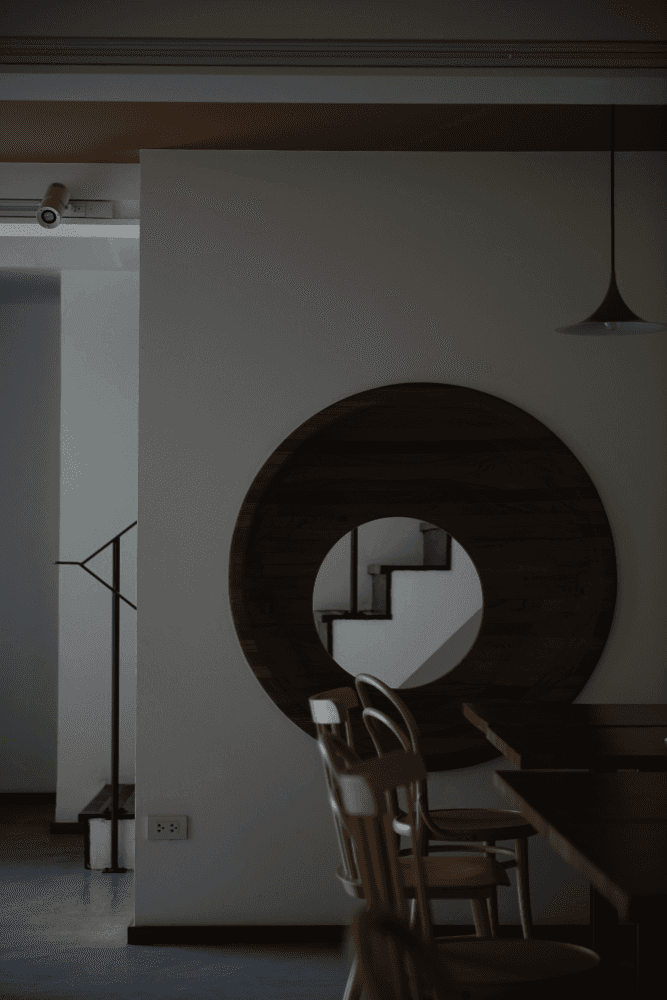 An orange cube-shaped side table is shown.