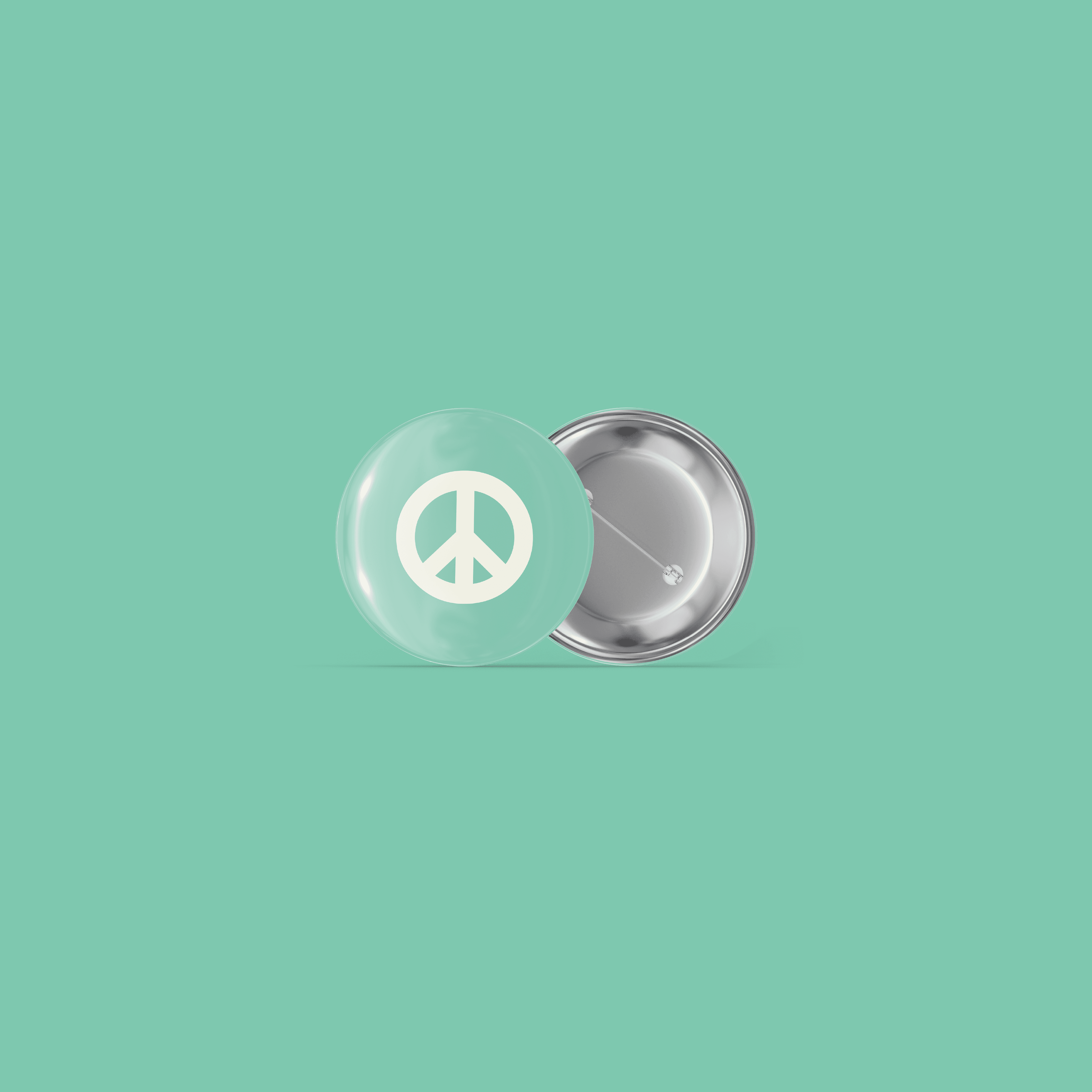 Two-sided pin badge with a cream peace symbol on a teal background.