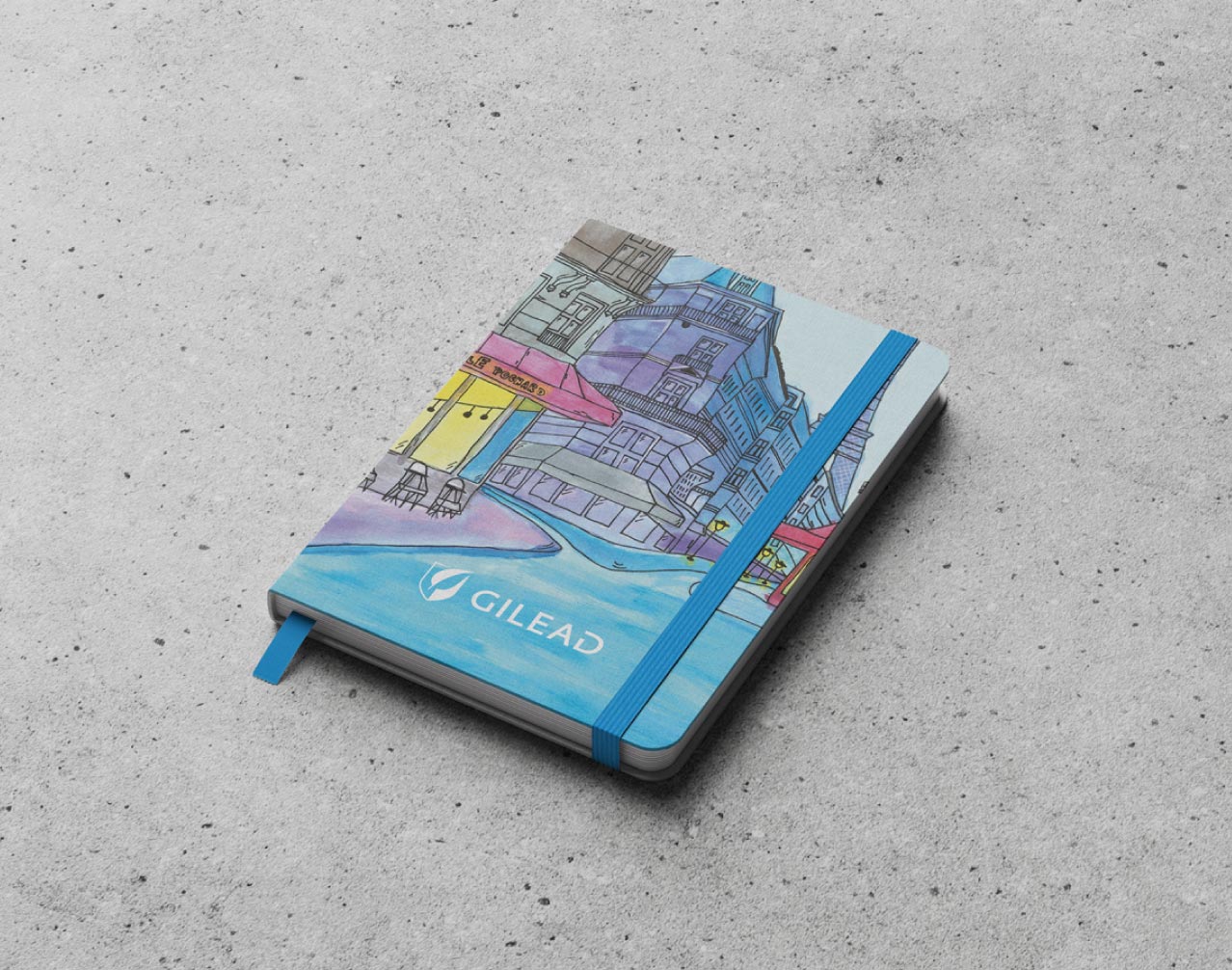 Kolorowy notes Urtica ułożony skośnie na betonowym tle