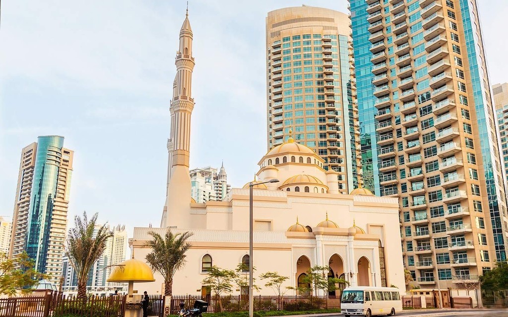 The Lakes mosque Dubai: tall modern buildings in background, religious site.