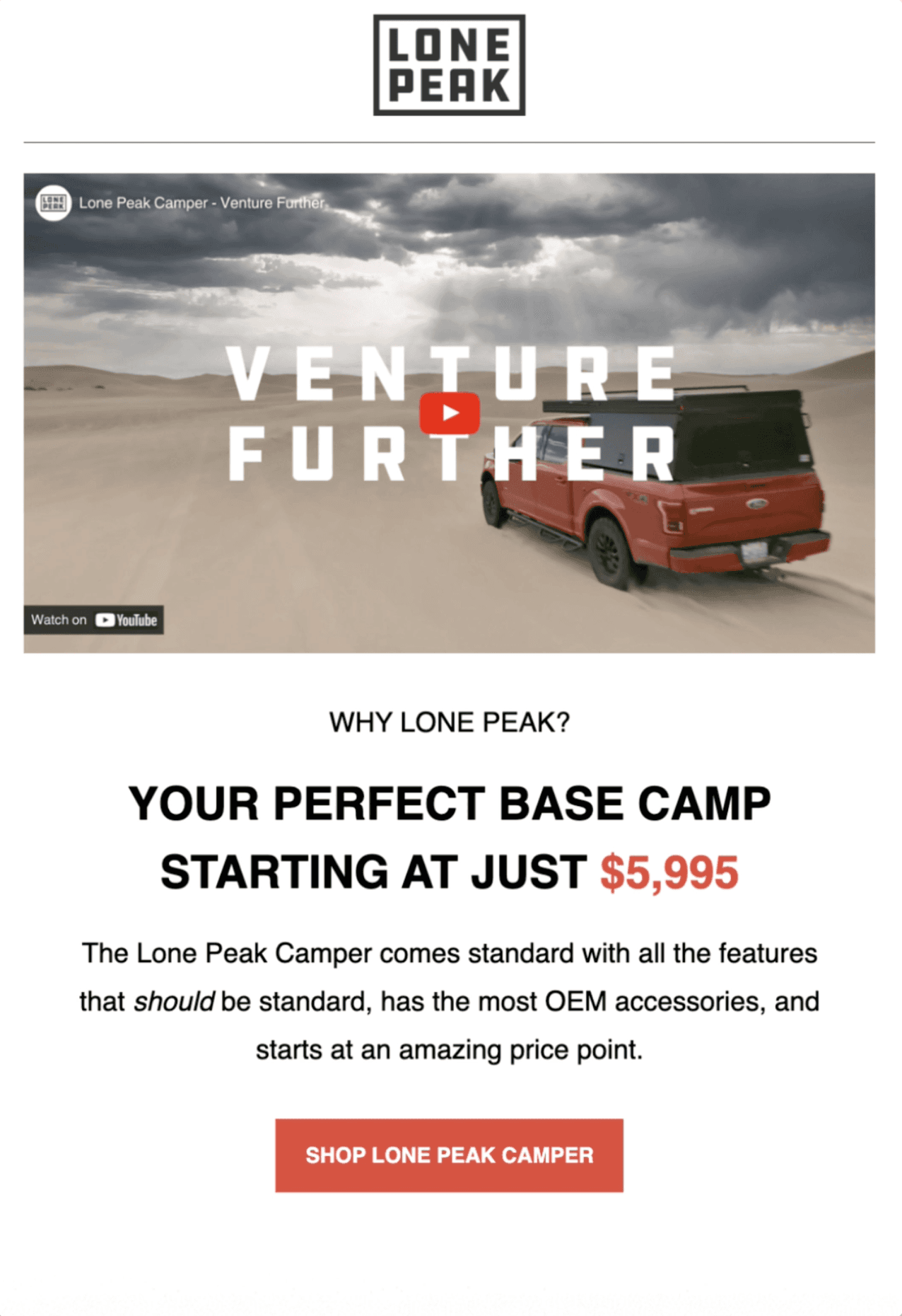 Black and white photo of two people looking at a computer screen with papers on wall