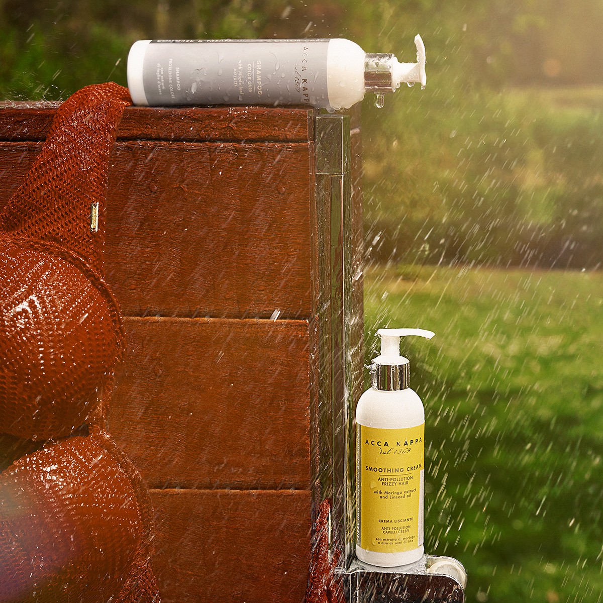 Monochrome product shot: black-capped cosmetic bottle with dynamic water splash on a clean white background.