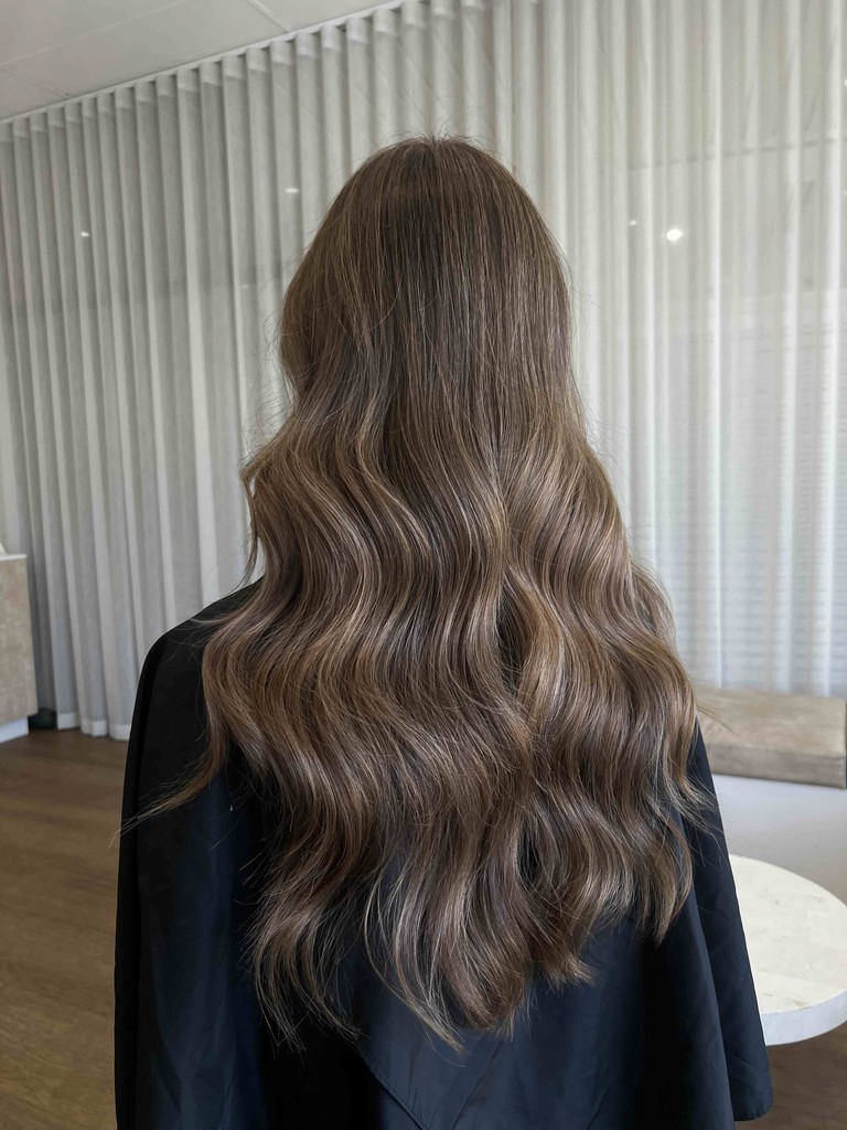 Model with long brown hair done by Goldi