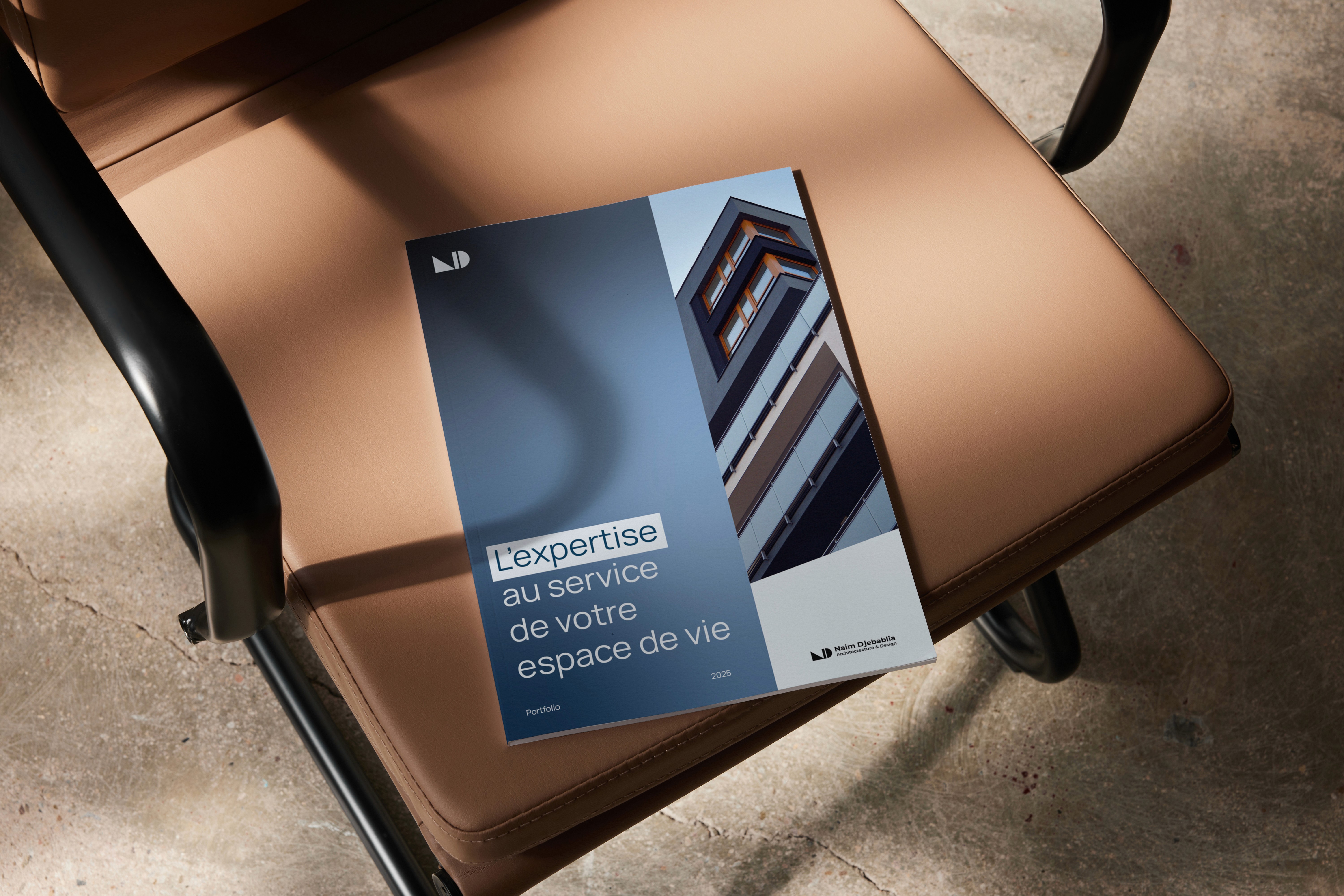 Large outdoor wall mural split vertically: a weathered pink field on the left and a pale concrete panel on the right bearing “AVANT GALLERY” in bold black at top and “Emma Carter – Reflections in Colour 5th December – 12th January” at bottom, set above a city pavement.