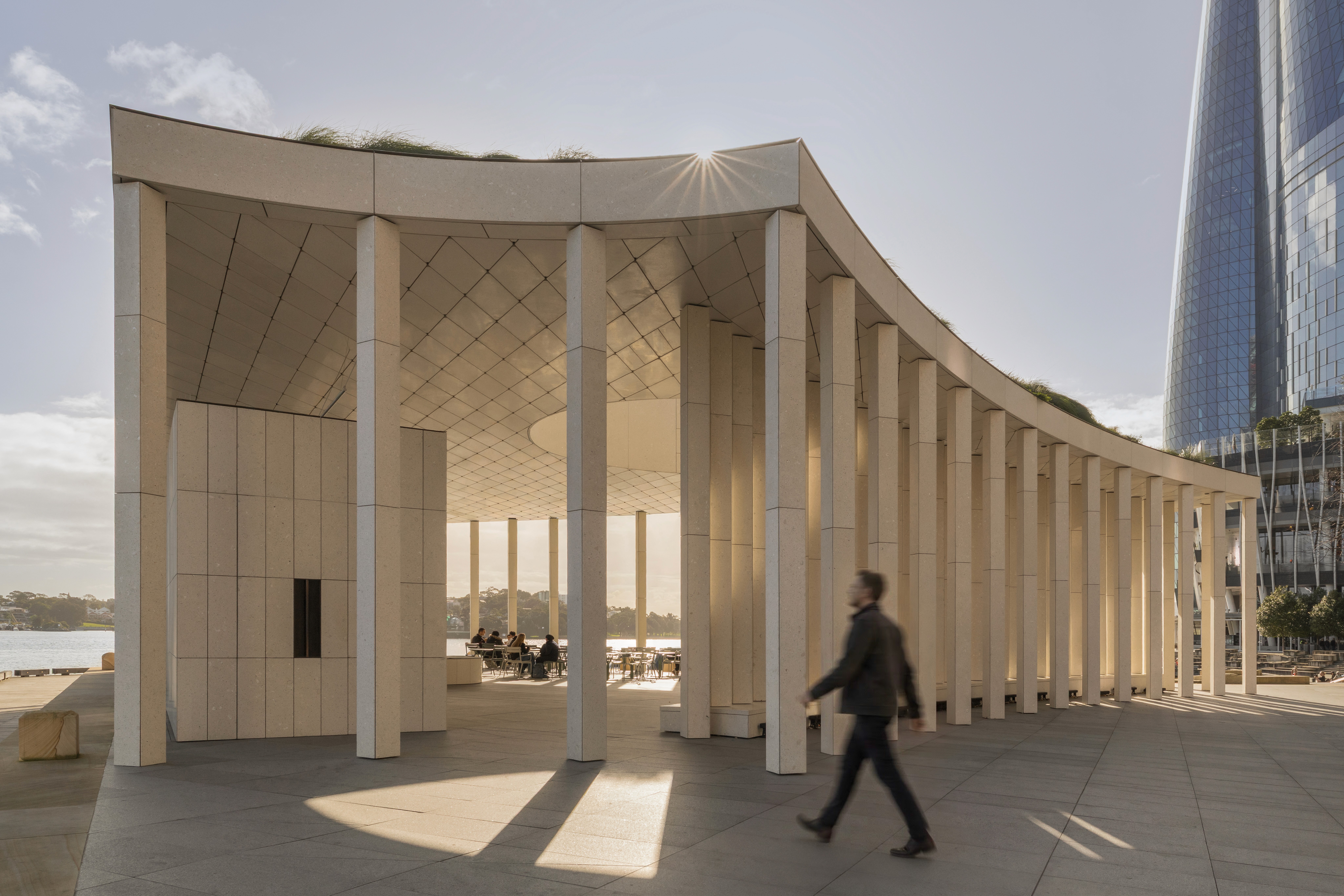 Human occupation completes the composition. Movement, pause, and chance encounters animate the disciplined geometry, revealing architecture as an evolving civic experience rather than a static form.