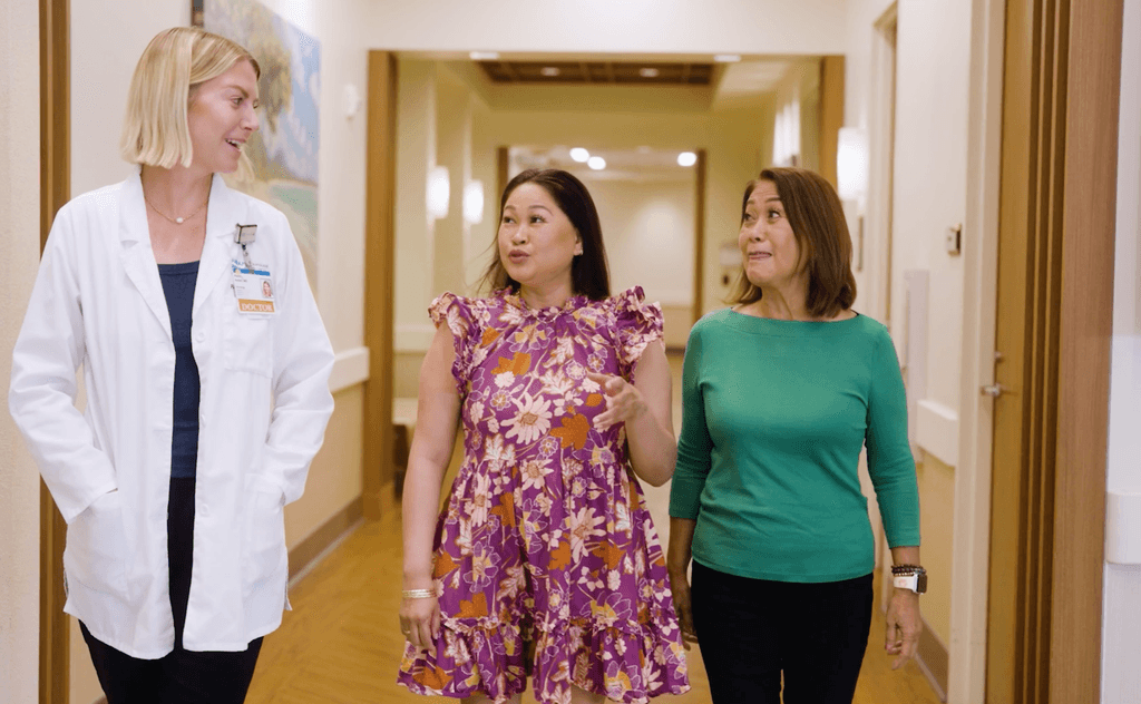 Doctor speaking with patients in clinical setting