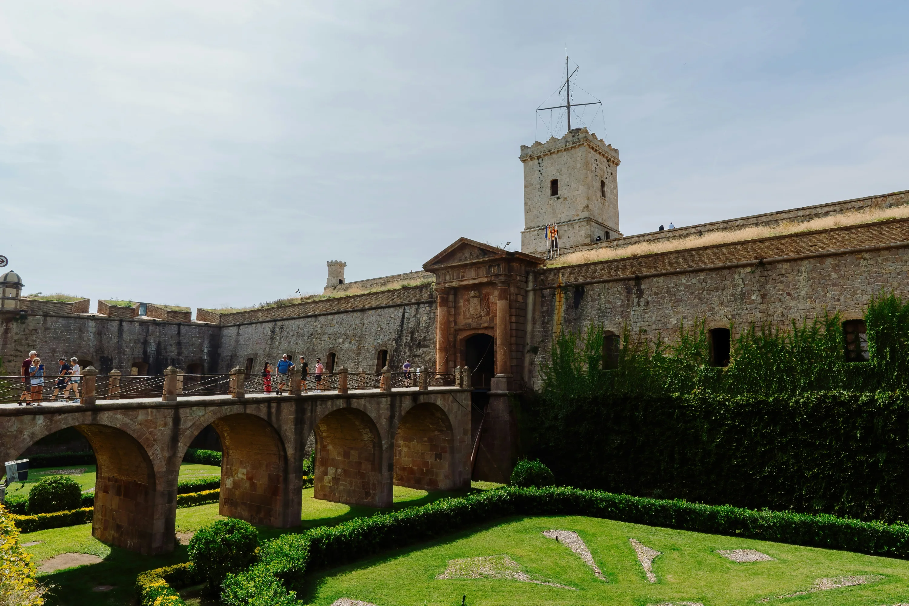 The raised entryway into the front of the Montjuïc Castle on a sunny day.