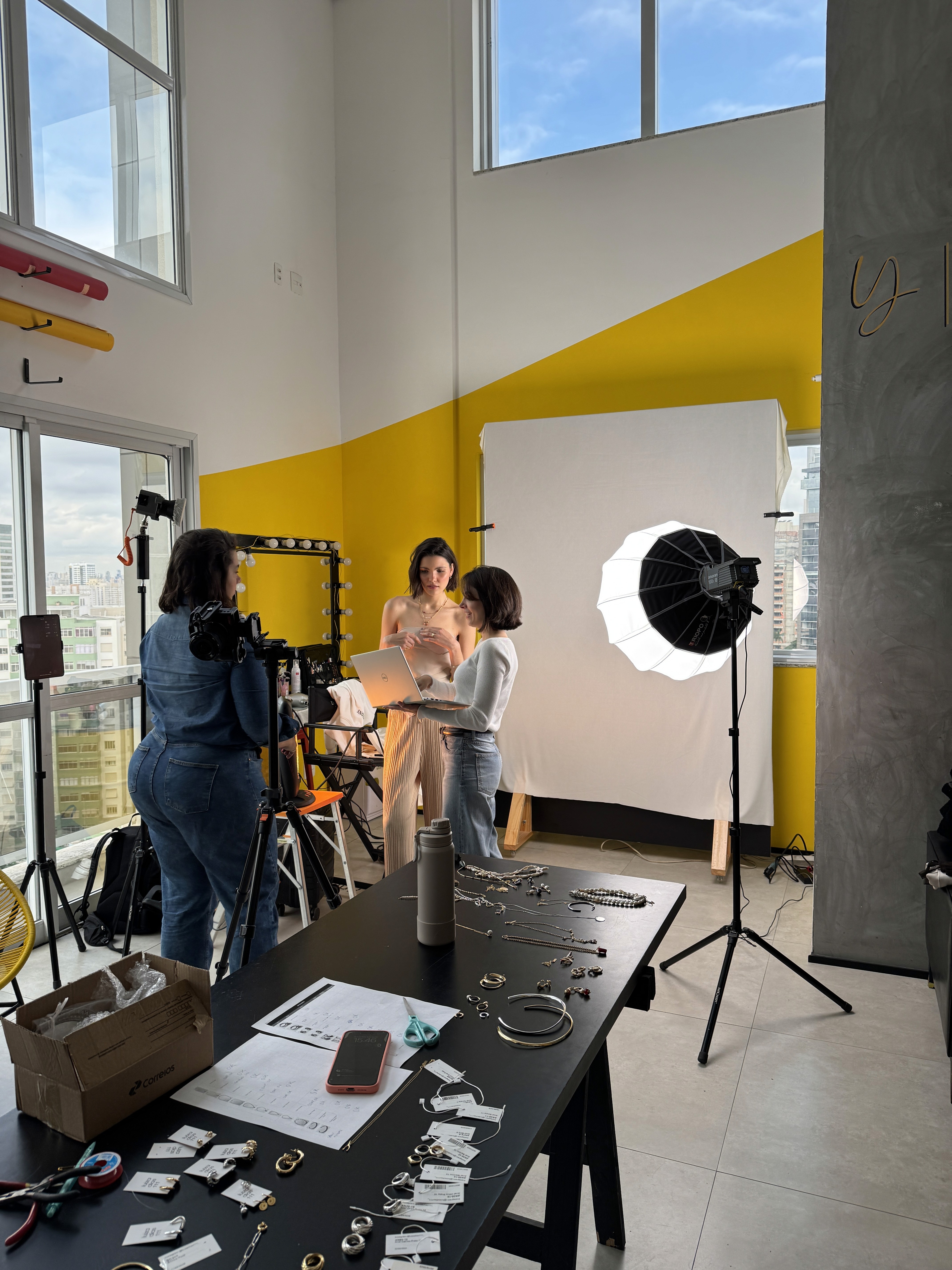 Close-up of a dark green leaf showing its textured surface and central vein against a muted background.
