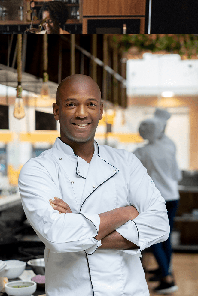 Image of a chef looking at the view, smiling, in a busy professional image