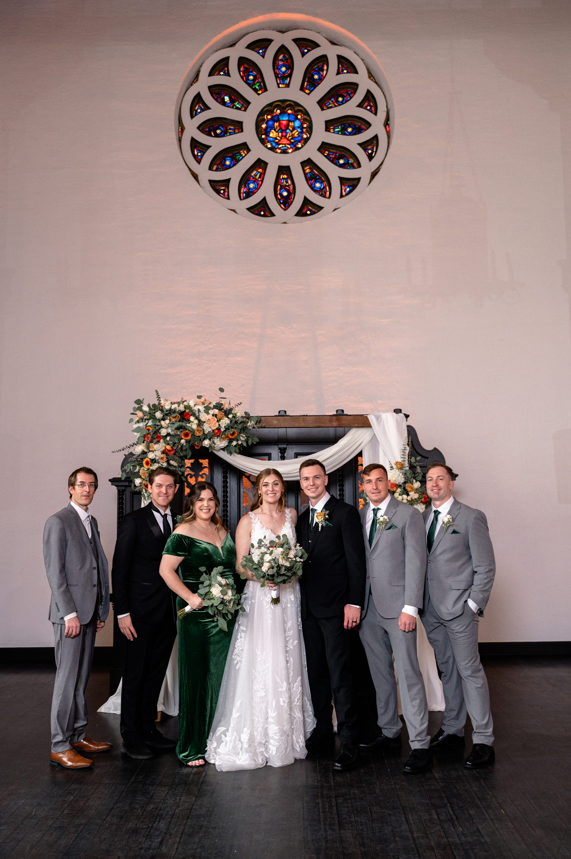 Flat lay wedding details with bouquet, rings, and sparkling bridal heels