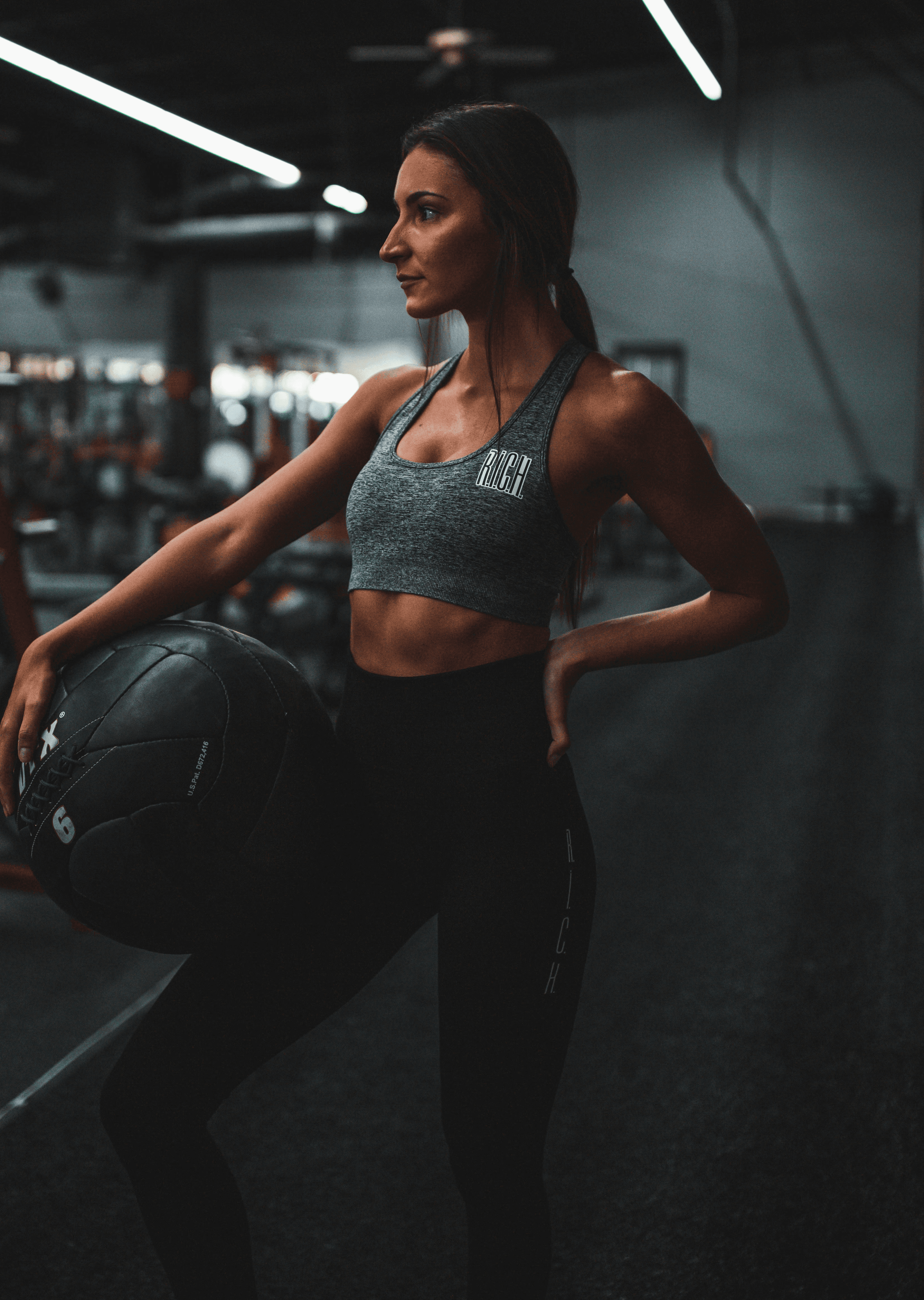 woman standing and holding ball