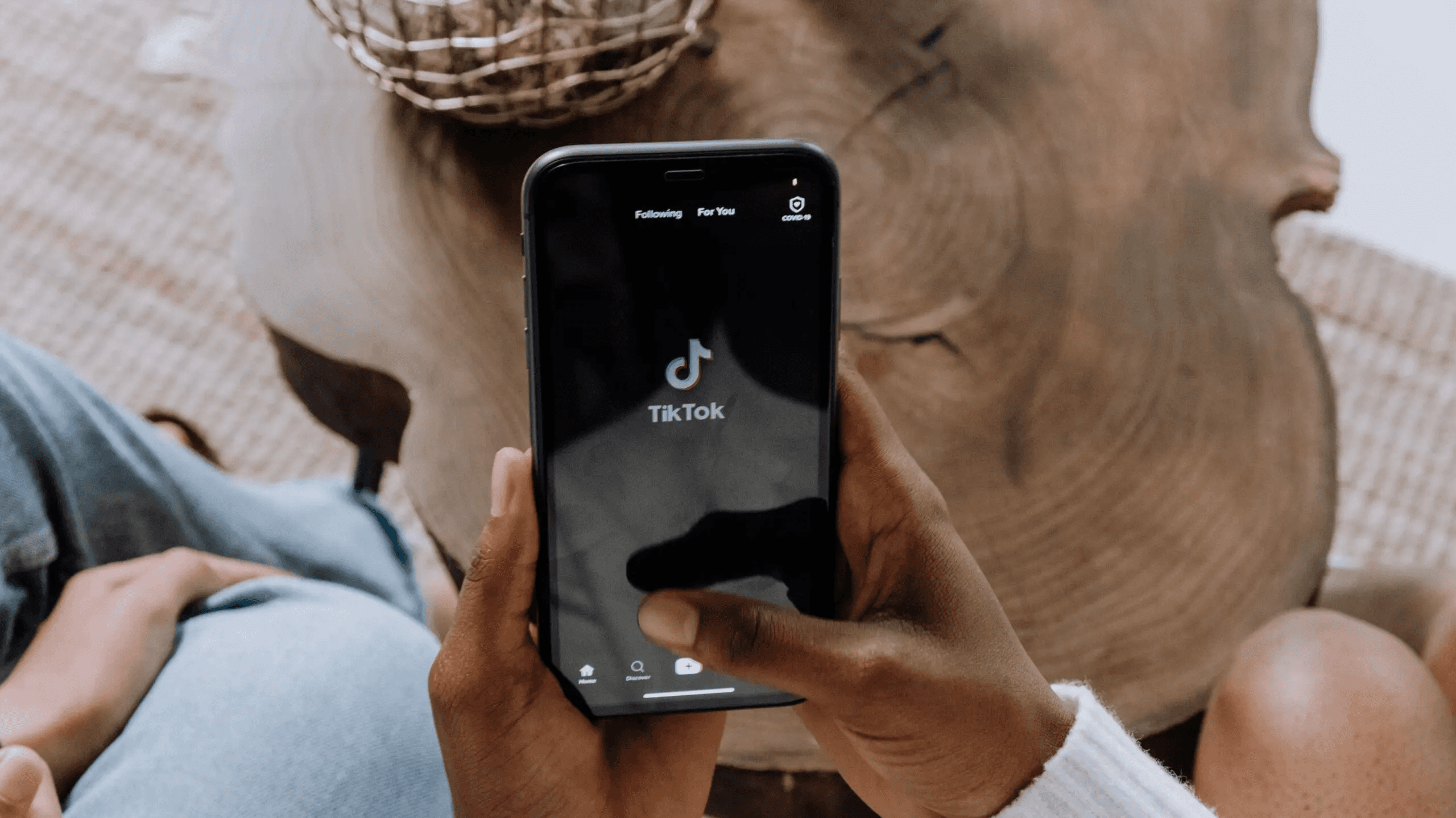 Person holding phone with TikTok - How Much Do Content Creators Make on TikTok